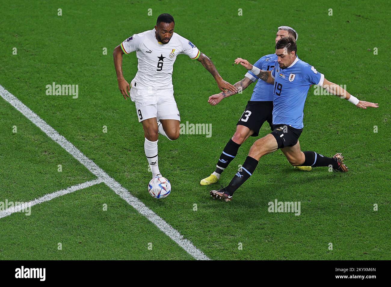 Doha, Qatar. 02nd Dec, 2022. Jordan Ayew of Ghana disputes the bid with Guillermo Varela and Sebastian Coates of Uruguay, during the match between Ghana and Uruguay, for the 3rd round of Group H of the FIFA World Cup Qatar 2022, Al Janoub Stadium this Friday 02. 30761 (Heuler Andrey/SPP) Credit: SPP Sport Press Photo. /Alamy Live News Stock Photo