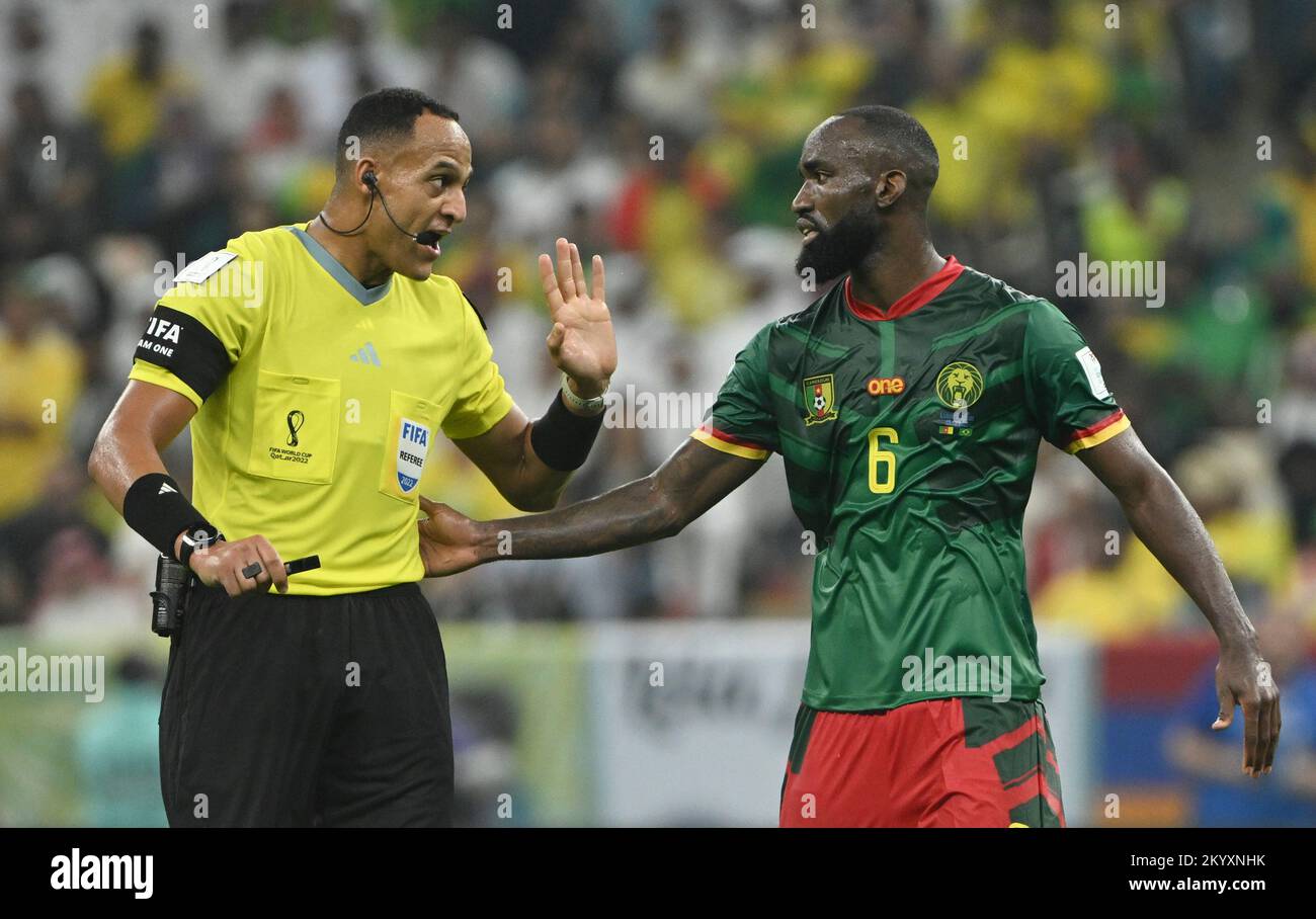 Lusail, Qatar. 2nd Dec, 2022. Nicolas Moumi Ngamaleu (R) of Cameroon talks to referee Fernando Andres Rapallini during the Group G match between Cameroon and Brazil at the 2022 FIFA World Cup at Lusail Stadium in Lusail, Qatar, Dec. 2, 2022. Credit: Li Ga/Xinhua/Alamy Live News Stock Photo