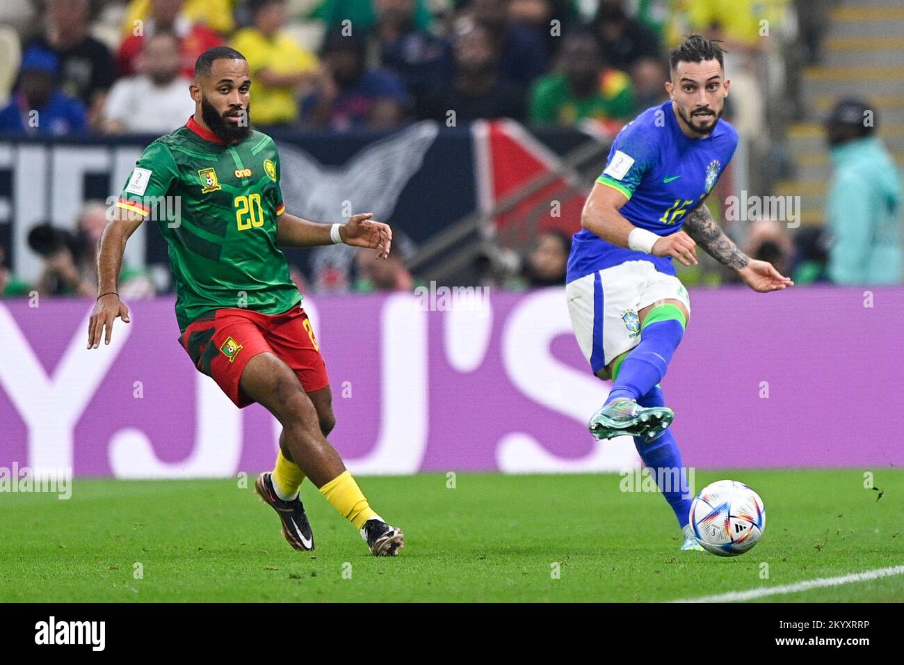 LUSAIL CITY, QATAR - DECEMBER 2: Bryan Mbeumo of Cameroon and Alex Telles of Brazil during the Group G - FIFA World Cup Qatar 2022 match between Cameroon and Brazil at the Lusail Stadium on December 2, 2022 in Lusail City, Qatar (Photo by Pablo Morano/BSR Agency) Stock Photo