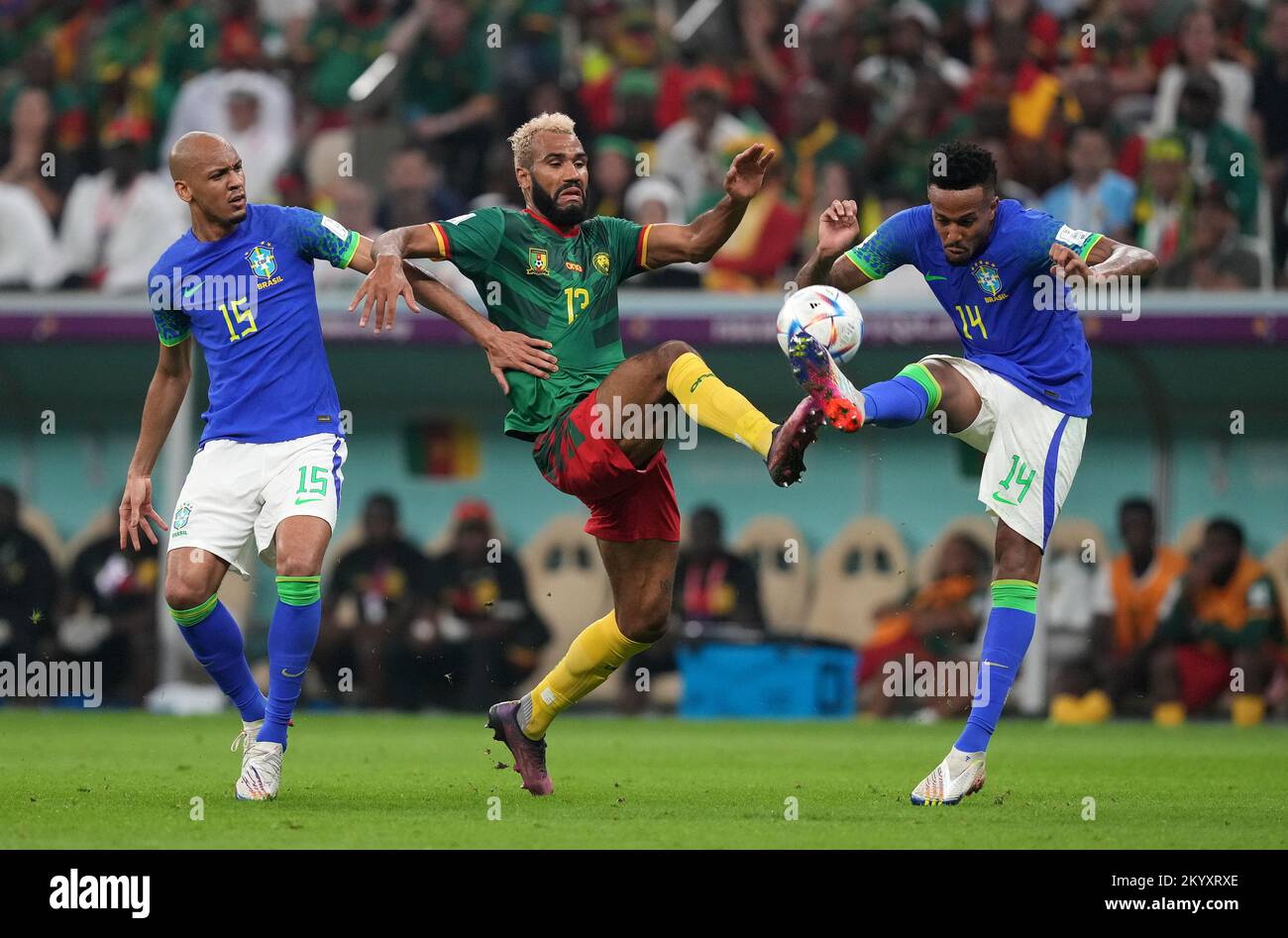 Cameroon's Eric Maxim Choupo-Moting (centre) takes on Brazil's Fabinho (left) and Eder Militao during the FIFA World Cup Group G match at the Lusail Stadium in Lusail, Qatar. Picture date: Friday December 2, 2022. Stock Photo