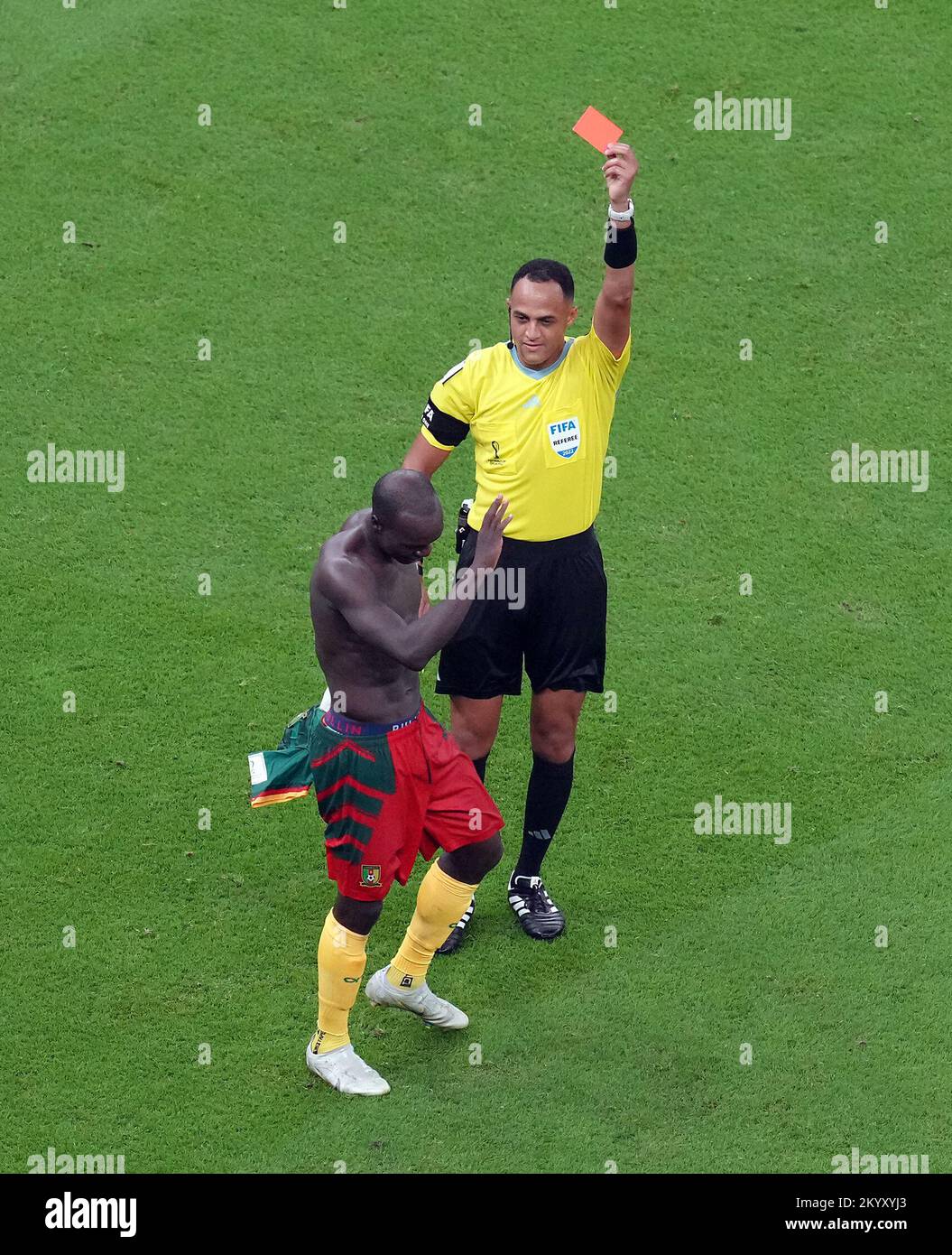 Cameroon's Vincent Aboubakar is sent off after taking his shirt off to celebrate scoring their side's first goal of the game to receive his second yellow card during the FIFA World Cup Group G match at the Lusail Stadium in Lusail, Qatar. Picture date: Friday December 2, 2022. Stock Photo