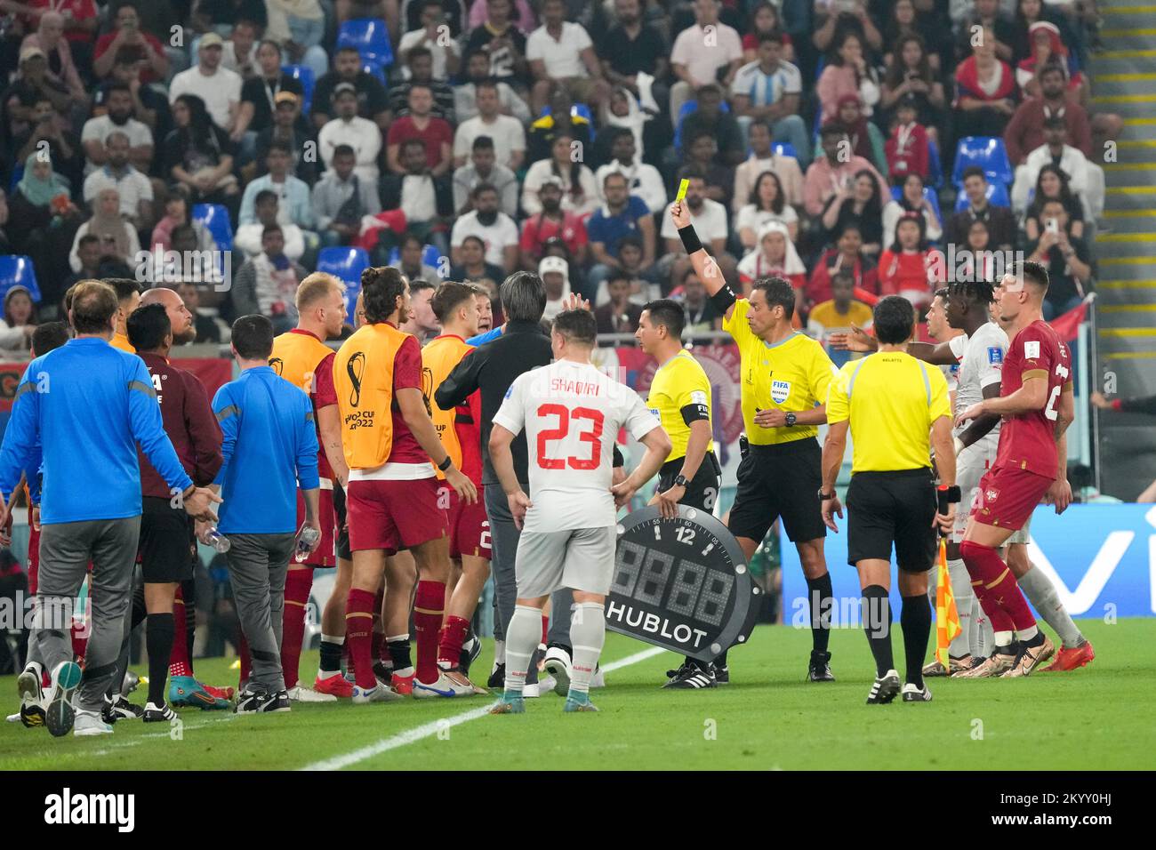 Doha, Qatar. 2nd Dec, 2022. Referee Fernando Andres Rapallini (5th R) gives a yellow card to Serbia's goalkeeper Predrag Rajkovic during the Group G match between Serbia and Switzerland at the 2022 FIFA World Cup at Stadium 974 in Doha, Qatar, Dec. 2, 2022. Credit: Li Gang/Xinhua/Alamy Live News Stock Photo