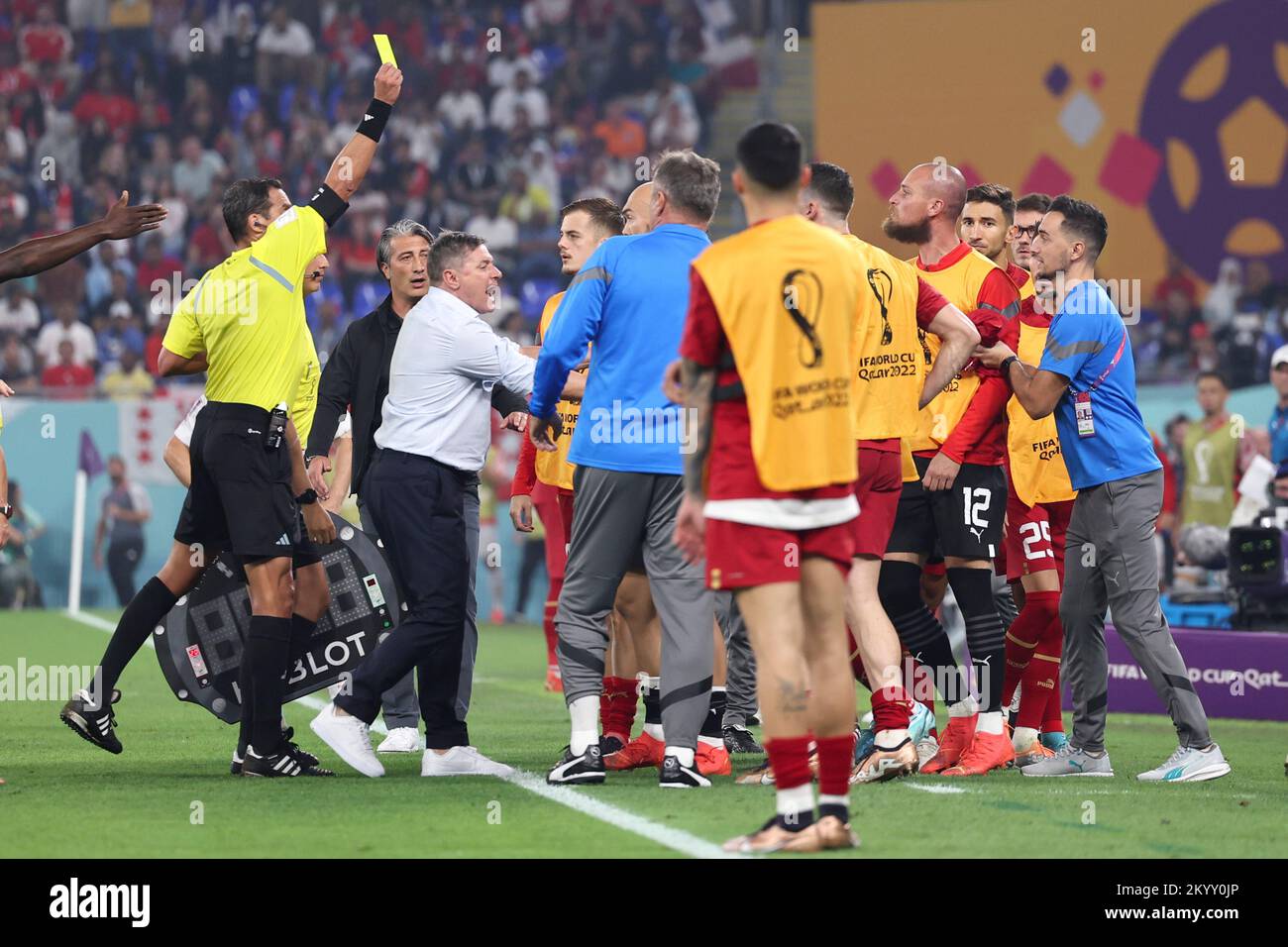 Doha, Qatar. 2nd Dec, 2022. Referee Fernando Andres Rapallini (1st L) gives a yellow card to Serbia's goalkeeper Predrag Rajkovic during the Group G match between Serbia and Switzerland at the 2022 FIFA World Cup at Stadium 974 in Doha, Qatar, Dec. 2, 2022. Credit: Xu Zijian/Xinhua/Alamy Live News Stock Photo
