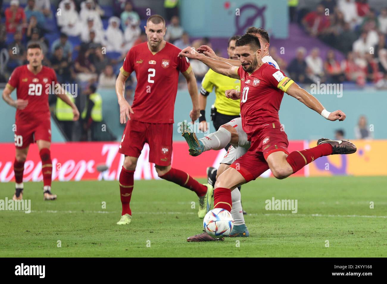 Doha, Qatar. 2nd Dec, 2022. Dusan Tadic (R) of Serbia shoots during the Group G match between Serbia and Switzerland at the 2022 FIFA World Cup at Stadium 974 in Doha, Qatar, Dec. 2, 2022. Credit: Xu Zijian/Xinhua/Alamy Live News Stock Photo