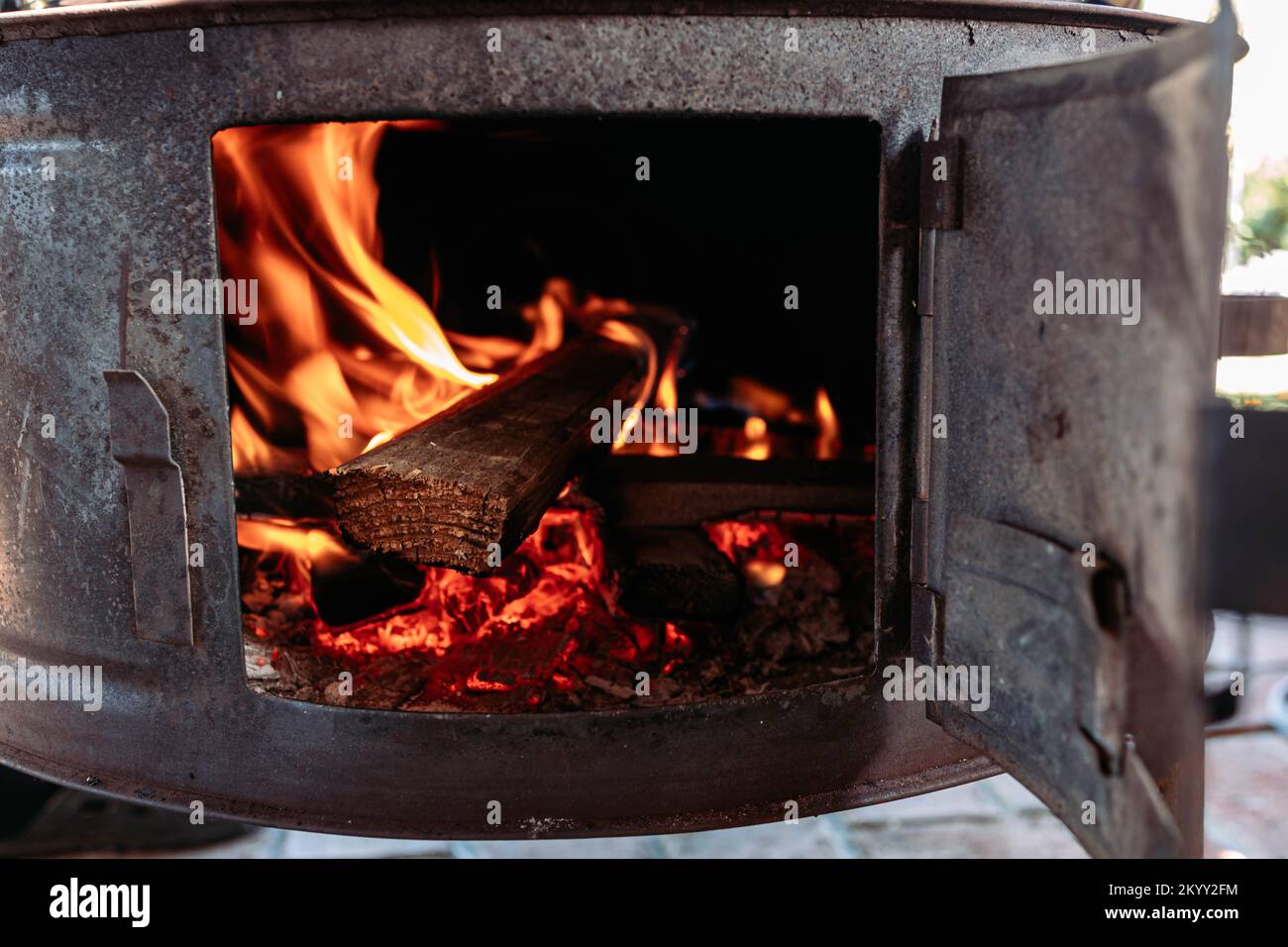 Closeup of a wood stove burning fire Stock Photo Alamy