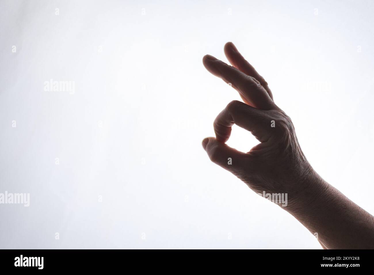 Ok hand gesture isolated on white background Stock Photo