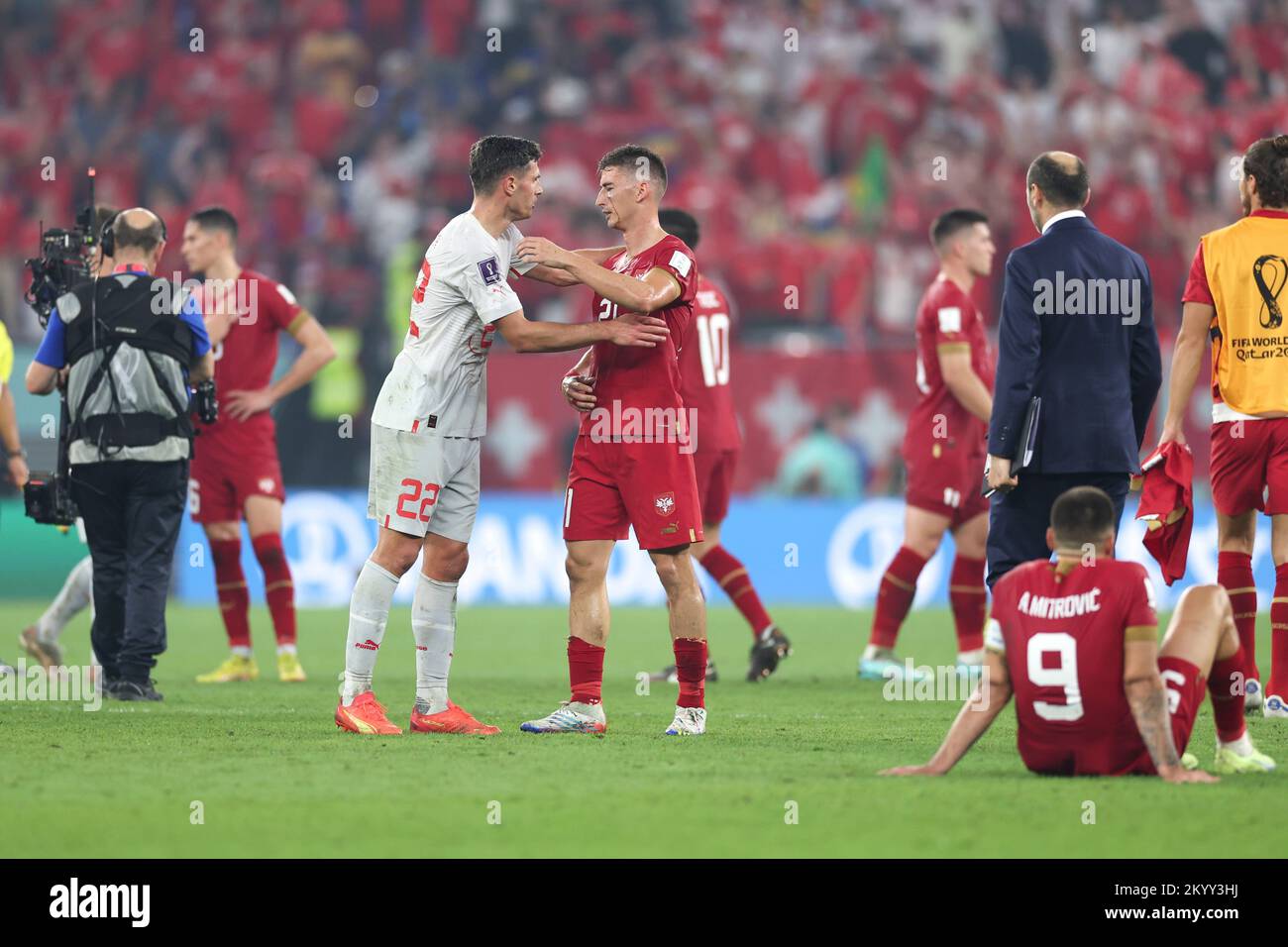 Doha, Qatar. 2nd Dec, 2022. Filip Djuricic (center R) of Serbia hugs with Fabian Schaer of Switzerland after their Group G match at the 2022 FIFA World Cup at Stadium 974 in Doha, Qatar, Dec. 2, 2022. Credit: Xu Zijian/Xinhua/Alamy Live News Stock Photo