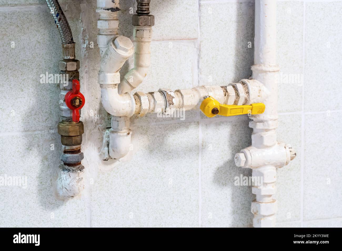 Home gas pipe installation, pipes at an old house, gas powered water heater in a bathroom or a