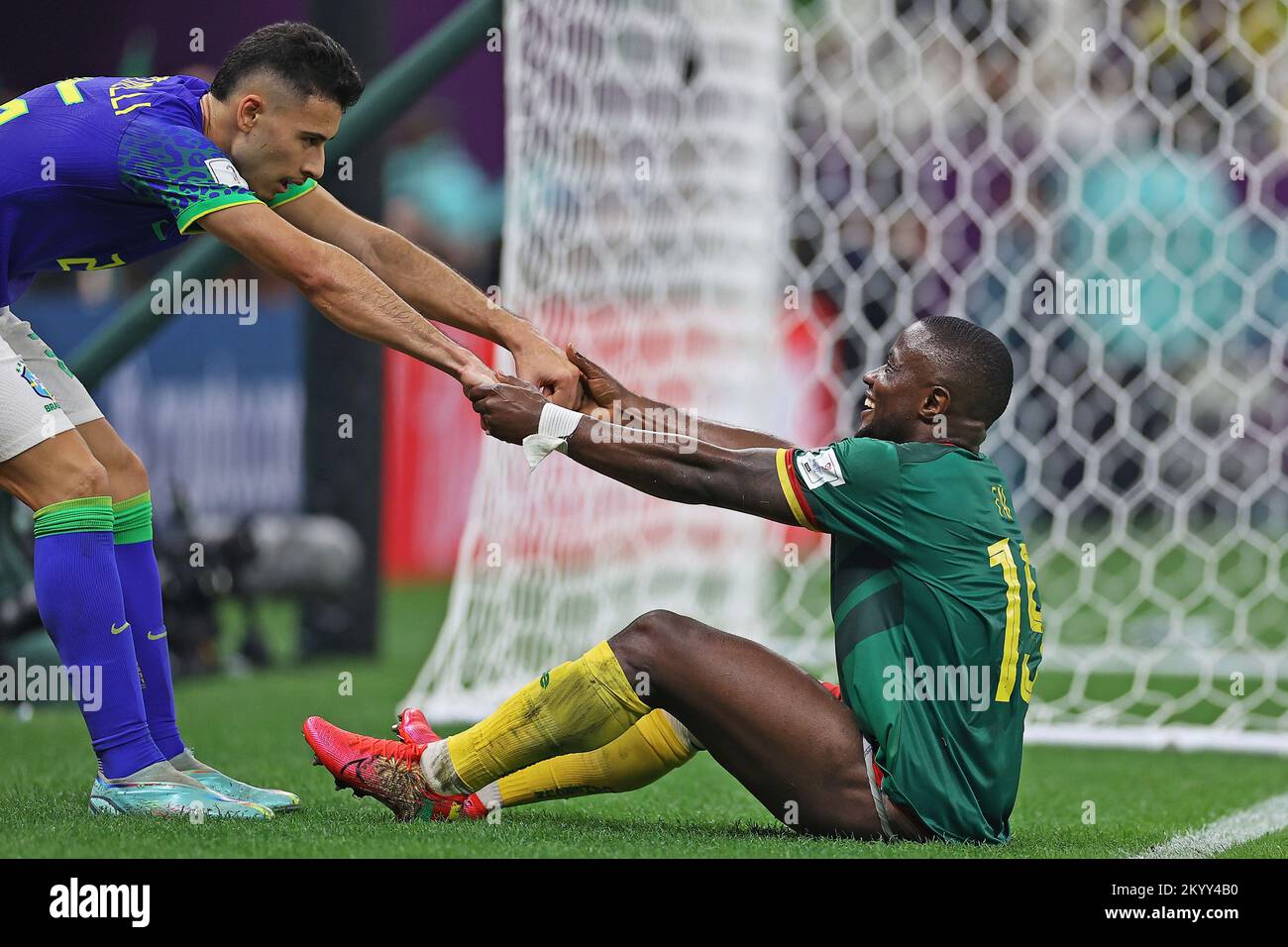 Lusail Iconic Stadium, Lusail, Qatar. 2nd Dec, 2022. FIFA World Cup Football, Cameroon versus Brazil; Collins Fai of Cameroon helped up at the end of the game by Gabriel Martinelli of Brazil Credit: Action Plus Sports/Alamy Live News Stock Photo