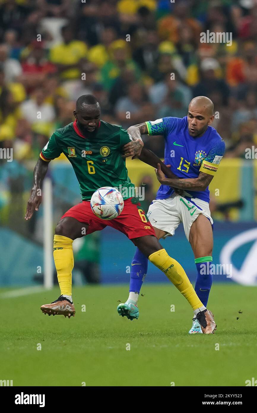 Lusail, Qatar. 02nd Dec, 2022. Lusail Stadium LUSAIL, QATAR - DECEMBER 2: Player of Brazil Dani Alves fights for the ball with player of Cameroon Nicolas Moumi Ngamaleu during the FIFA World Cup Qatar 2022 group G match between Brazil and Cameroon at Lusail Stadium on December 2, 2022 in Lusail, Qatar. (Photo by Florencia Tan Jun/PxImages) (Florencia Tan Jun/SPP) Credit: SPP Sport Press Photo. /Alamy Live News Stock Photo