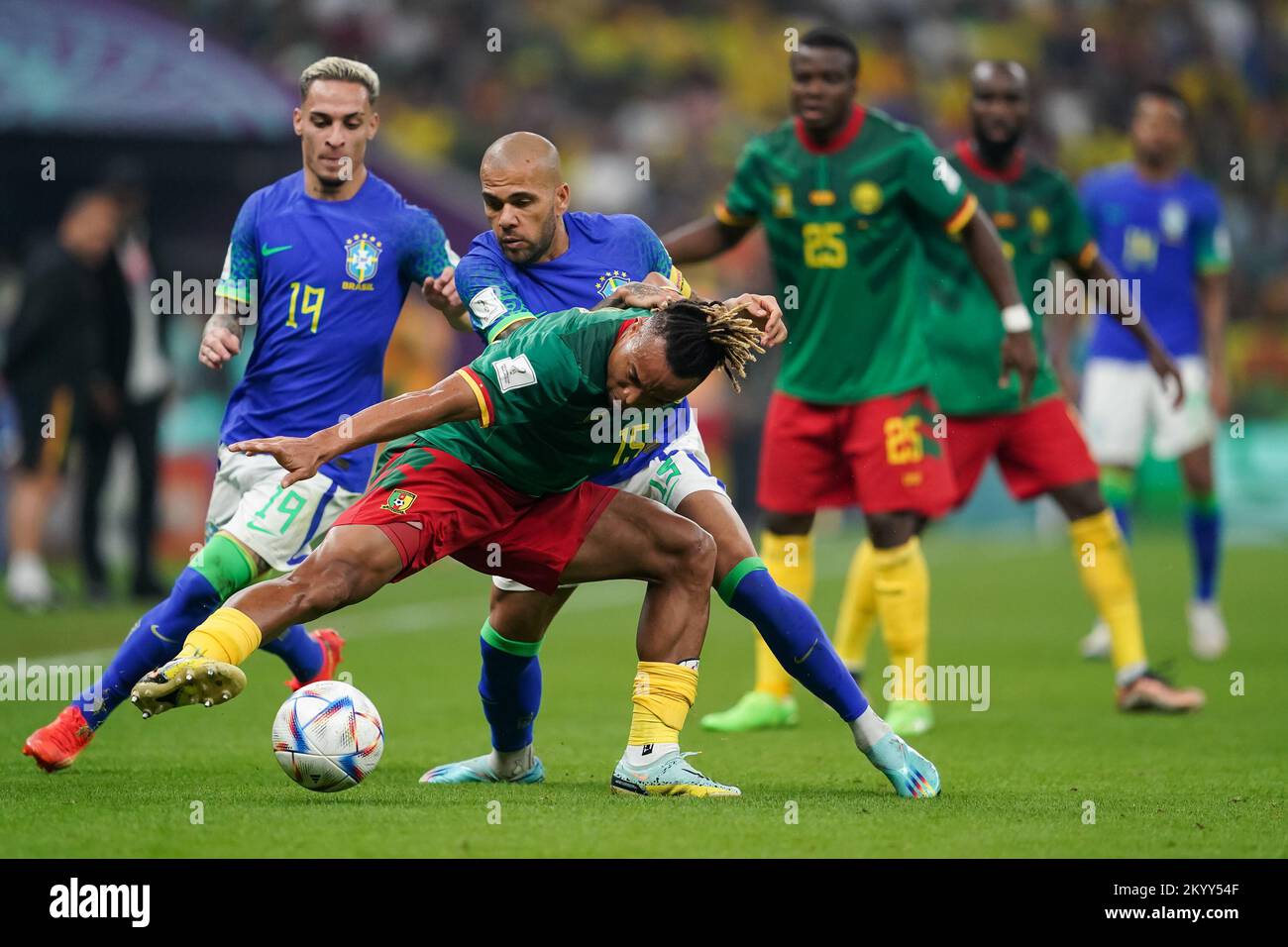 Lusail, Qatar. 02nd Dec, 2022. Lusail Stadium LUSAIL, QATAR - DECEMBER 2: Player of Brazil Dani Alves fights for the ball with player of Cameroon Pierre Kunde during the FIFA World Cup Qatar 2022 group G match between Brazil and Cameroon at Lusail Stadium on December 2, 2022 in Lusail, Qatar. (Photo by Florencia Tan Jun/PxImages) (Florencia Tan Jun/SPP) Credit: SPP Sport Press Photo. /Alamy Live News Stock Photo