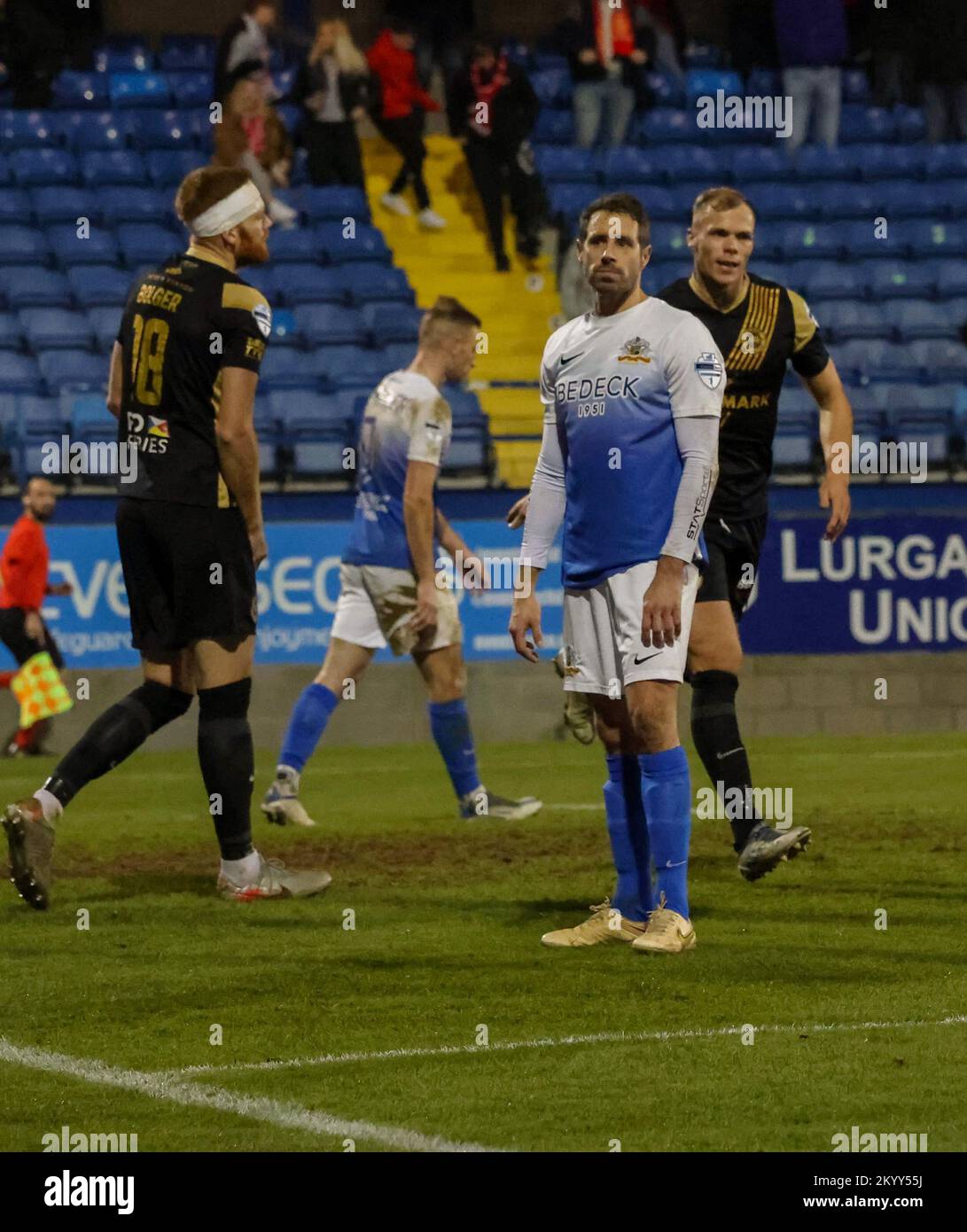 Mourneview Park, Lurgan, County Armagh, Northern Ireland, UK. 2 Dec 2022. Danske Bank Premiership – Glenavon v Larne Action from tonight's game at Mourneview Park (Glenavon in blue). An own goal from Gleavon's Sean Ward (right) was the difference between the teams. Credit: CAZIMB/Alamy Live News. Stock Photo