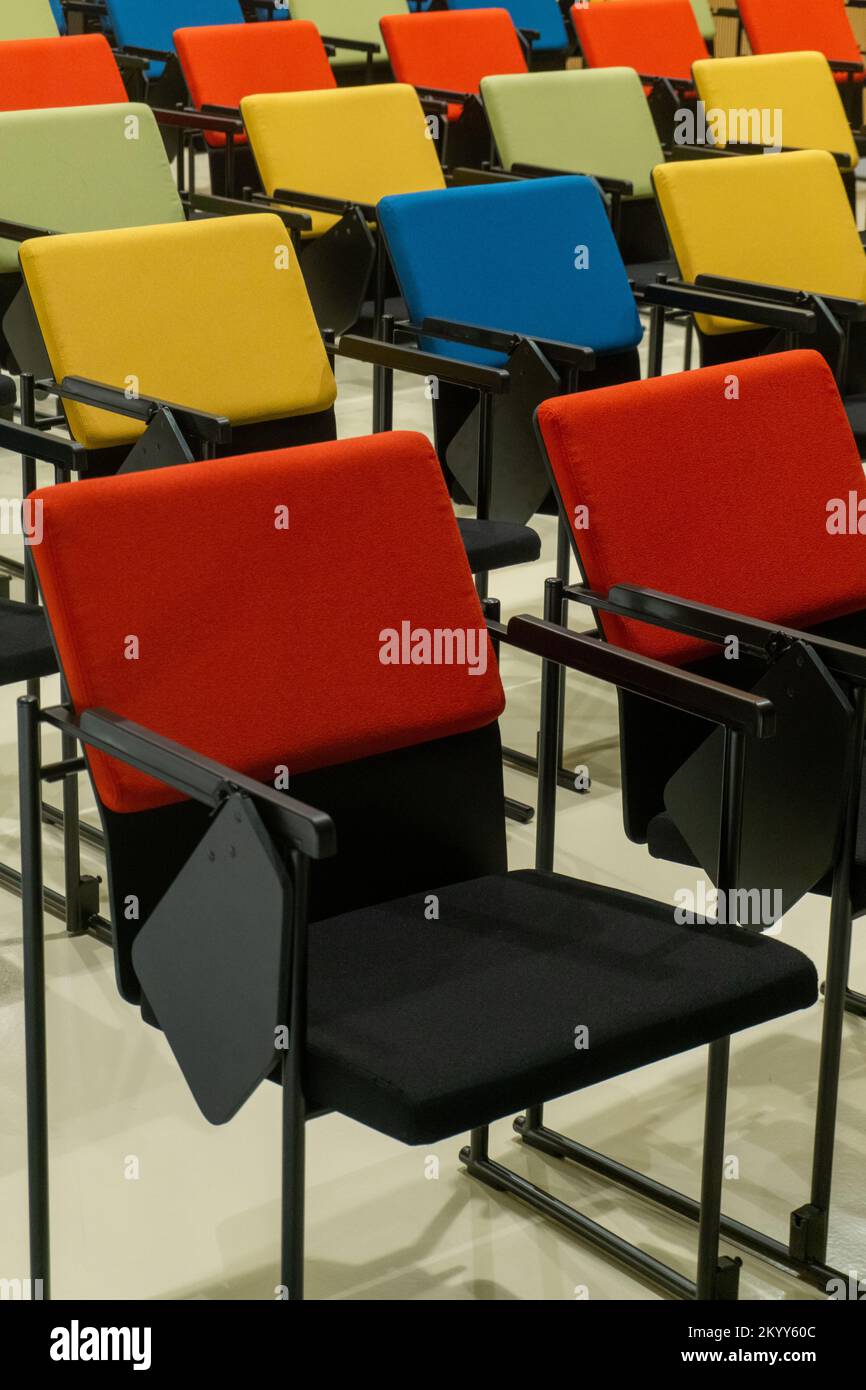 Rows of colourful seats in the hall Stock Photo - Alamy