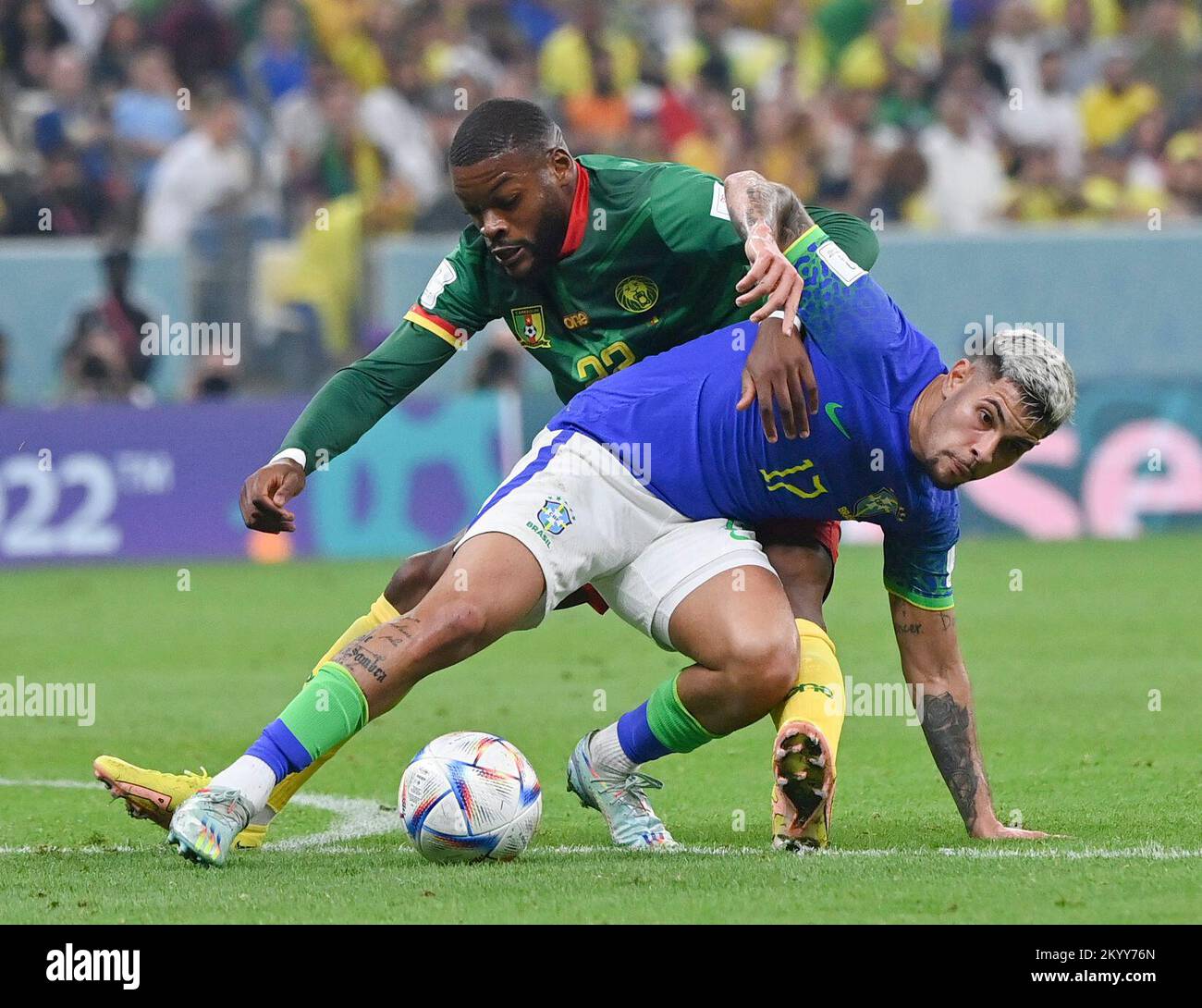 Lusail, Qatar. 2nd Dec, 2022. Bruno Guimaraes (R) of Brazil vies with Olivier Ntcham of Cameroon during their Group G match at the 2022 FIFA World Cup at Lusail Stadium in Lusail, Qatar, Dec. 2, 2022. Credit: Chen Cheng/Xinhua/Alamy Live News Stock Photo