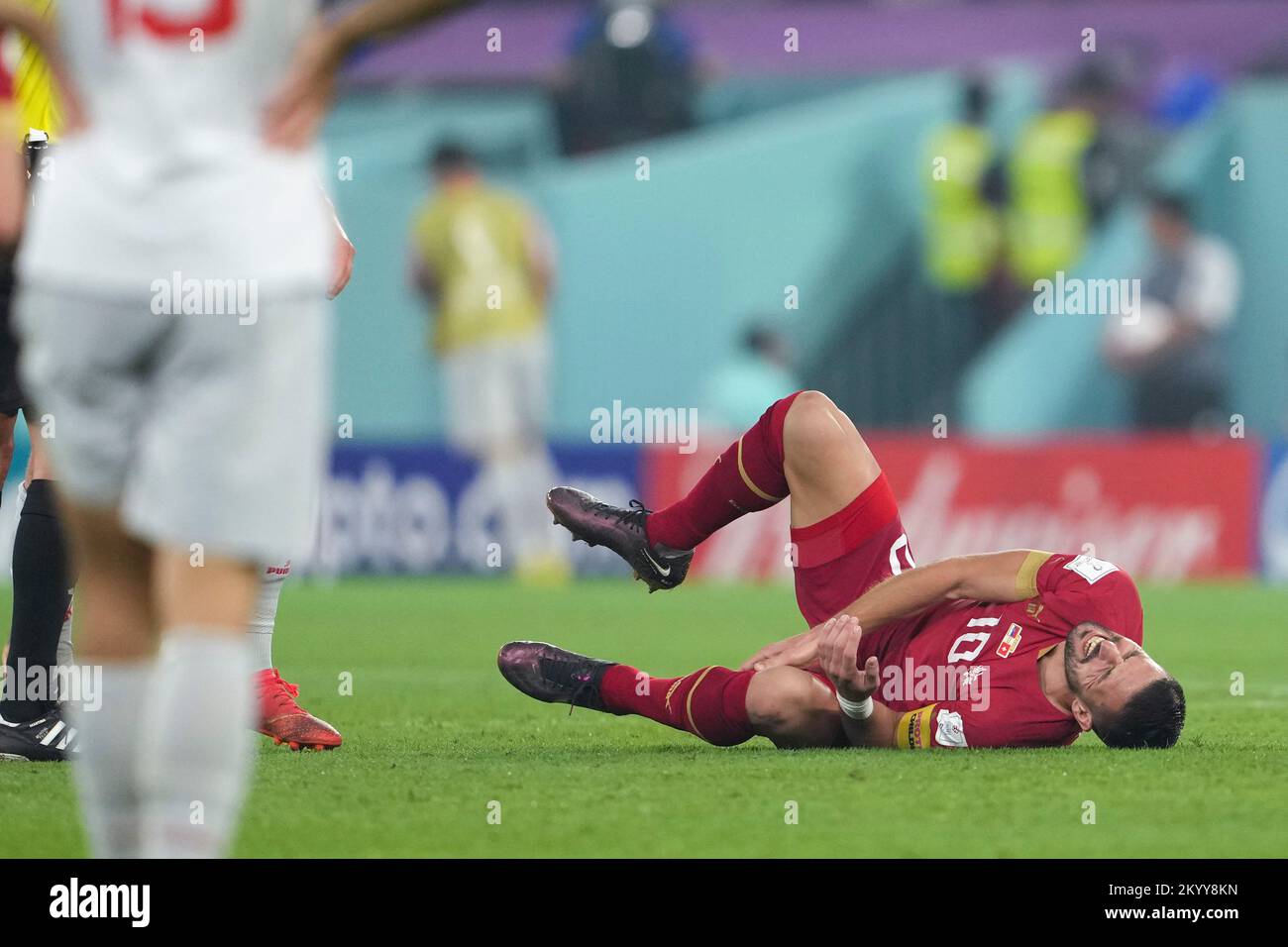 Doha, Qatar. 2nd Dec, 2022. Dusan Tadic of Serbia falls down during the Group G match between Serbia and Switzerland at the 2022 FIFA World Cup at Stadium 974 in Doha, Qatar, Dec. 2, 2022. Credit: Zheng Huansong/Xinhua/Alamy Live News Stock Photo
