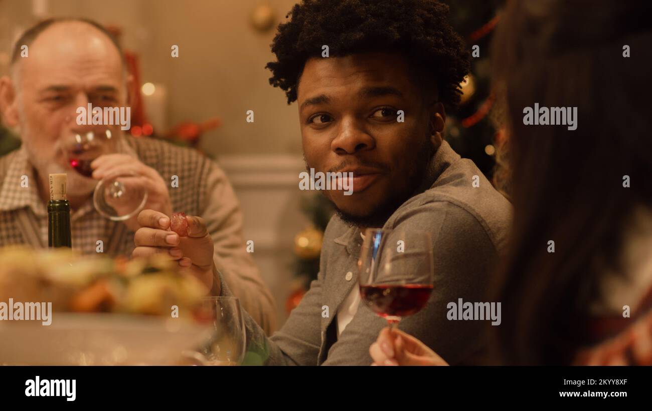 Happy multi cultural family celebrating Christmas or New Year 2023