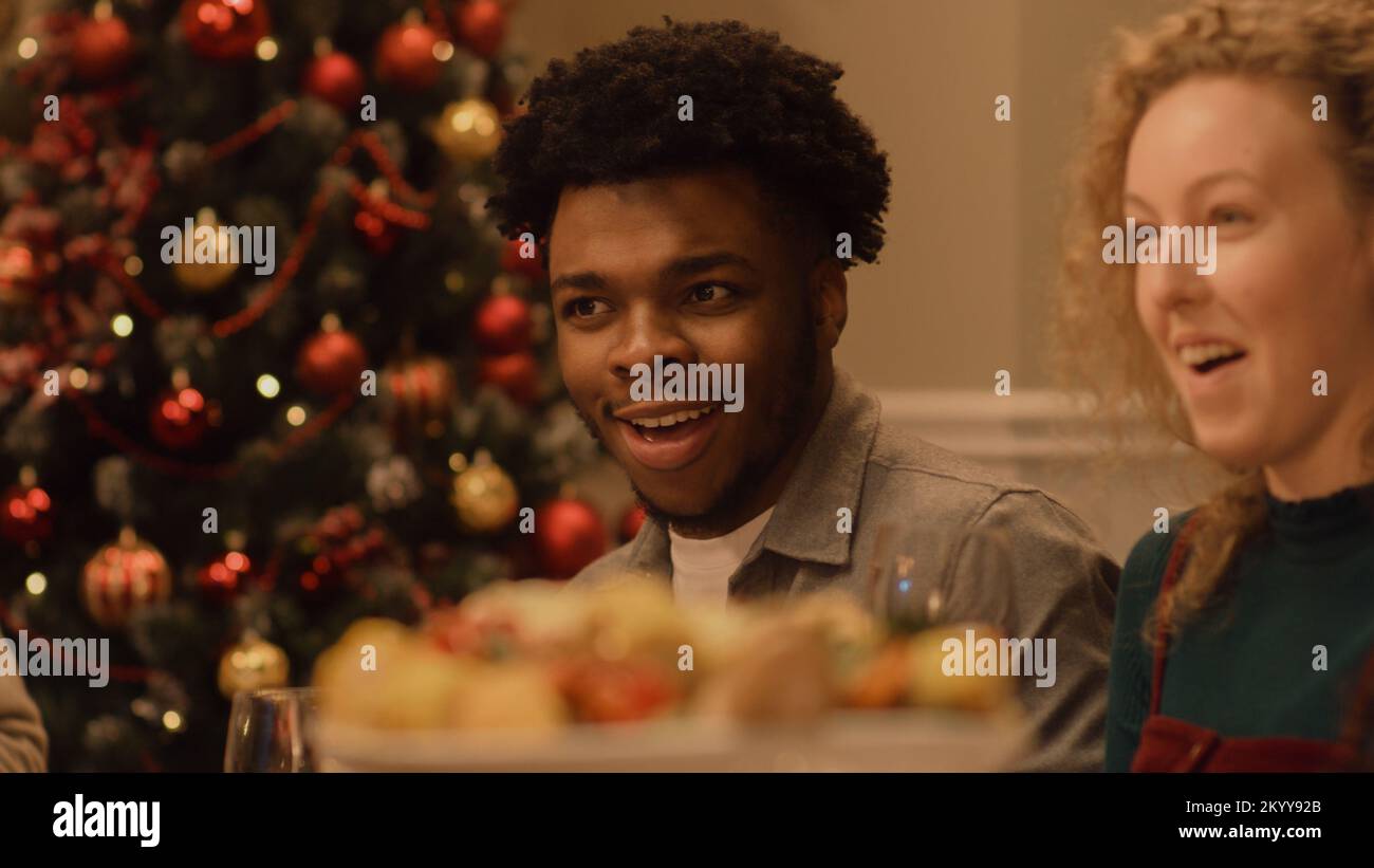 Happy multi cultural family celebrating Christmas or New Year 2023