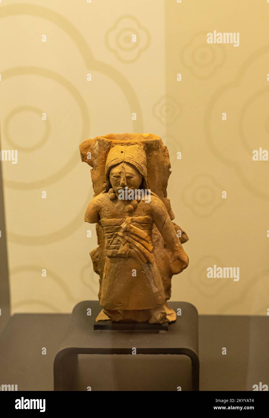 Mayan ceramic figurine of a woman with headpiece. Jaina, Campeche, Mexico. Late classic period. Stock Photo
