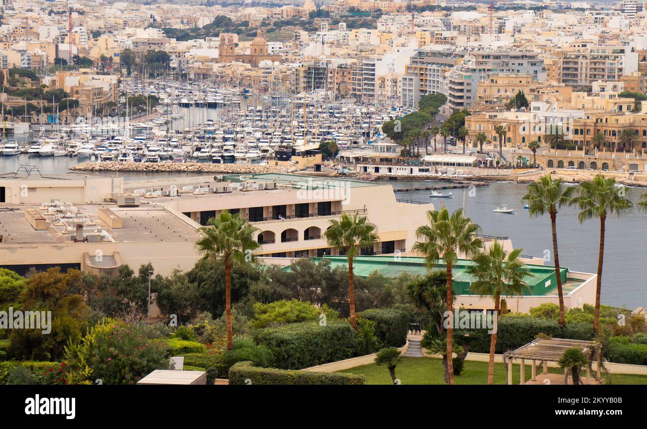 Panoramic view from Valletta fortification garden on Floriana Grand Hotel Excelsior with palm trees, bay and Msida Yacht Marina of Malta Stock Photo