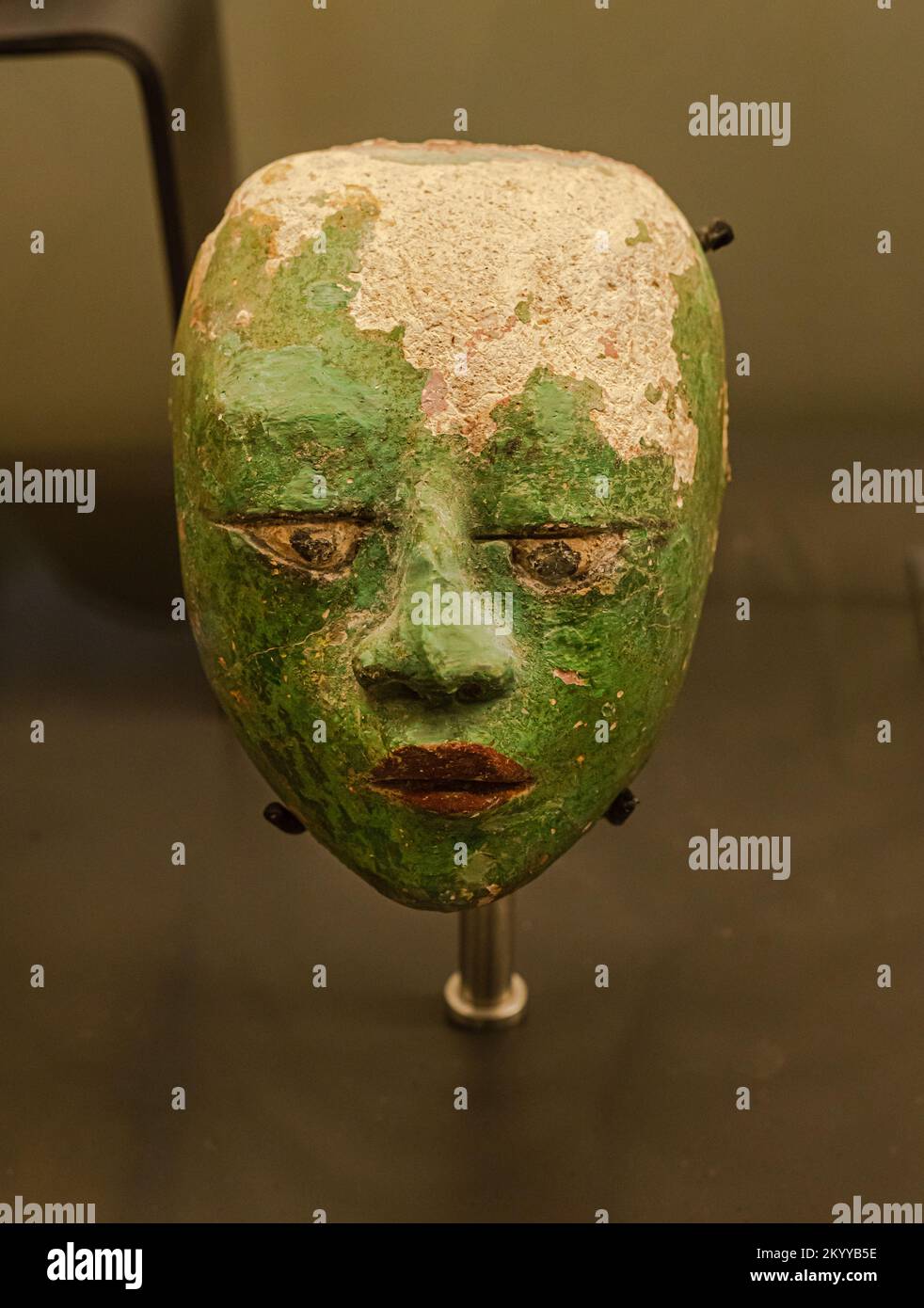 Stucco mask depicting the Maya crossed eyes practice of beauty. Late