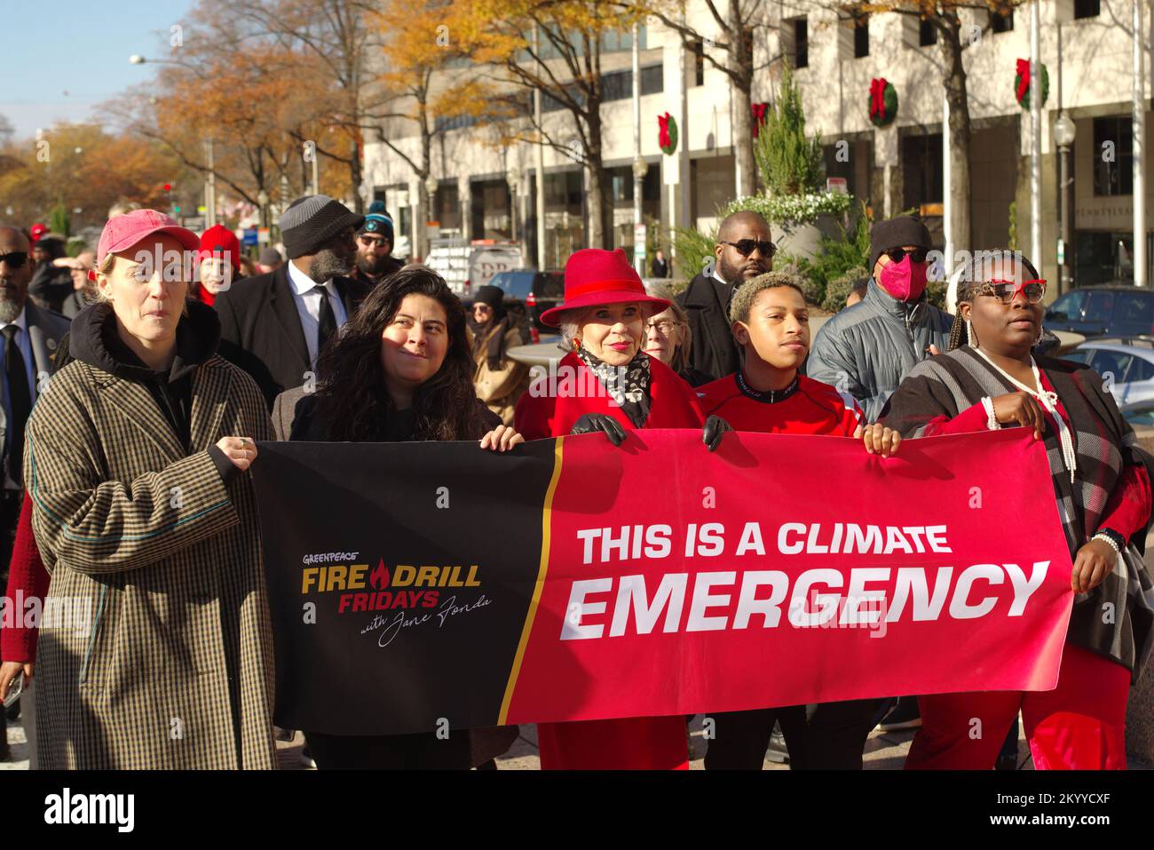 Washington DC, USA. 2 Dec 2022. Actor Jane Fonda marches with actor Taylor Schilling and local climate change activists in a Fire Drill Fridays rally in downtown Washington, DC. Credit: Philip Yabut/Alamy Live News Stock Photo