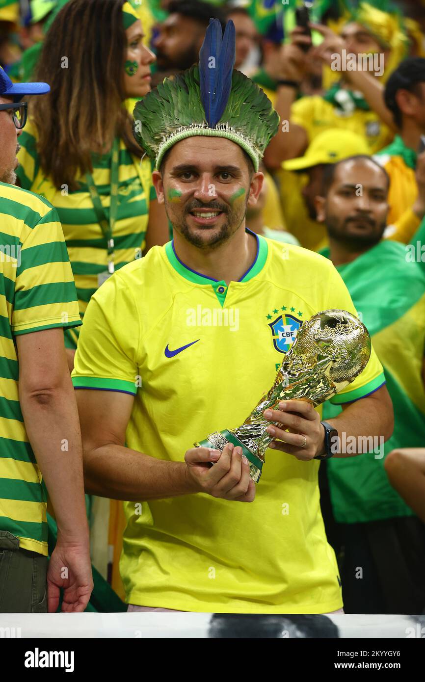 Doha, Qatar. 02nd Dec, 2022. A Brazil fan holds a replica of the World Cup trophy during the 2022 FIFA World Cup Group G match at Lusail Stadium in Doha, Qatar on December 02, 2022. Photo by Chris Brunskill/UPI Credit: UPI/Alamy Live News Stock Photo