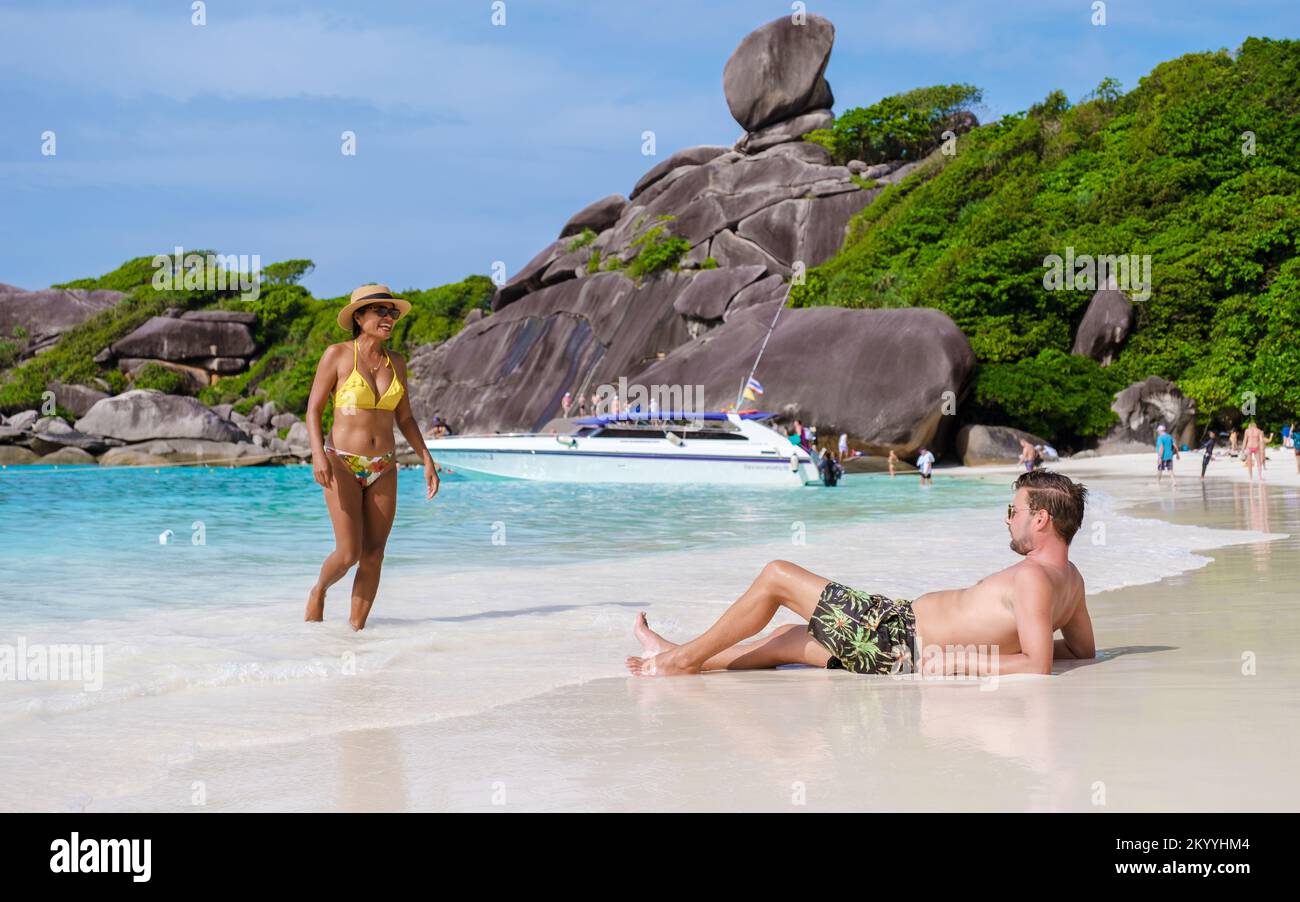 Similan Islands Thailand, couple men and women on a tropical beach in Thailand Stock Photo