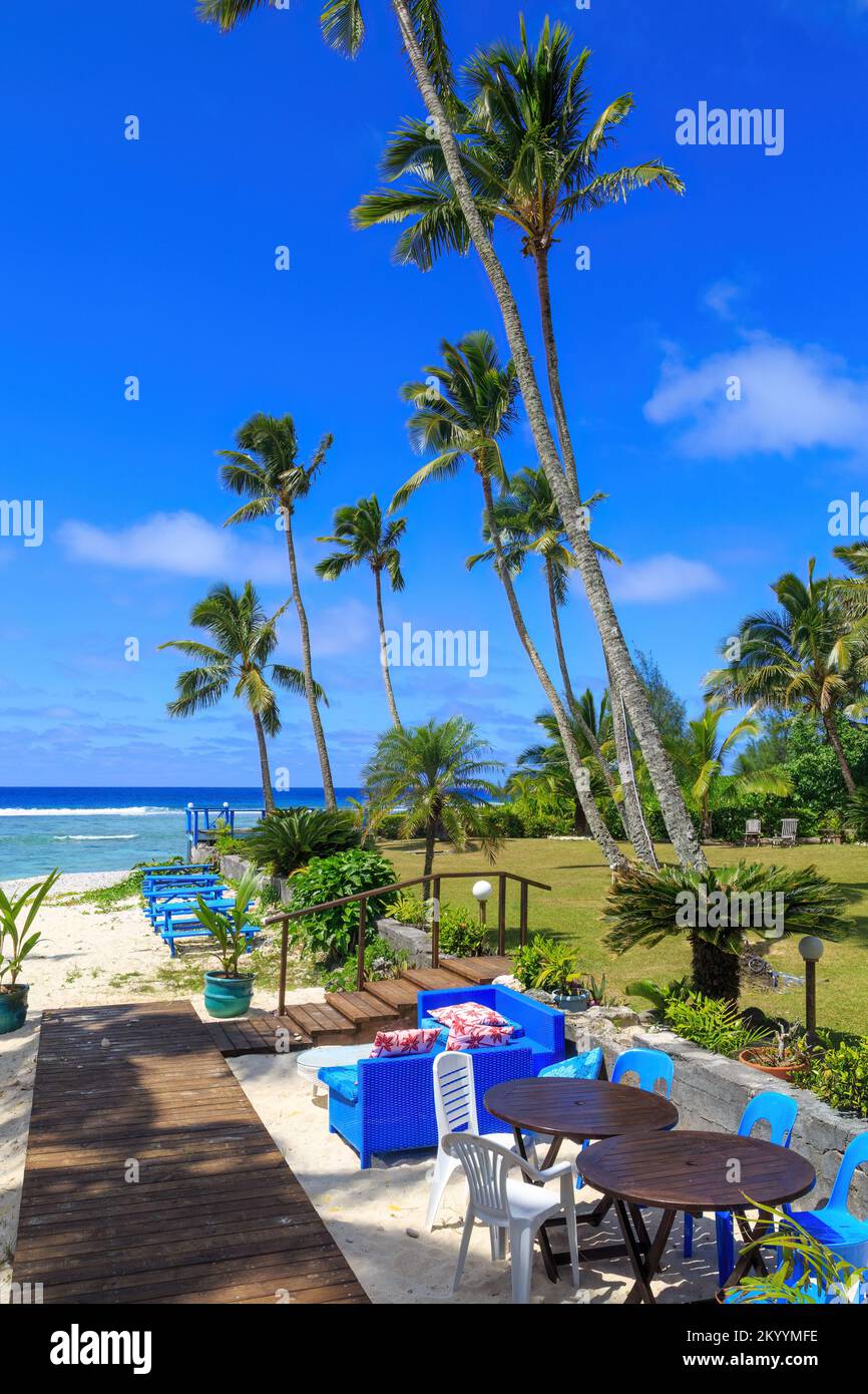 Chairs and tables set up on a beautiful tropical beach. Rarotonga, Cook