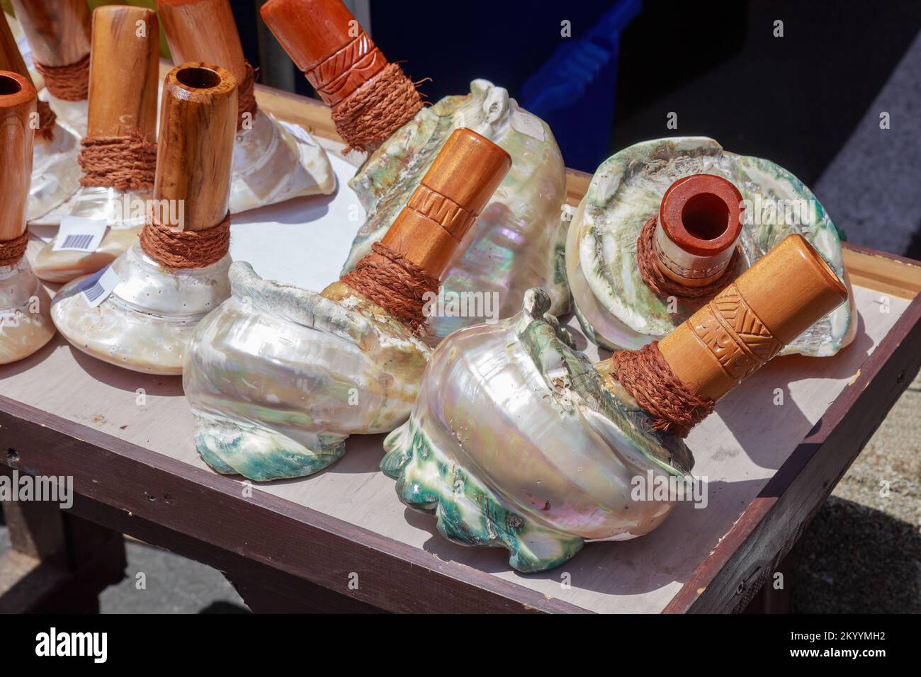 Trumpets made out of trochus (sea snail) shells for sale at a market on the tropical island of Rarotonga, Cook Islands Stock Photo
