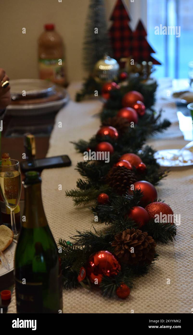 festive Christmas garland stretched across a long dining room table ...