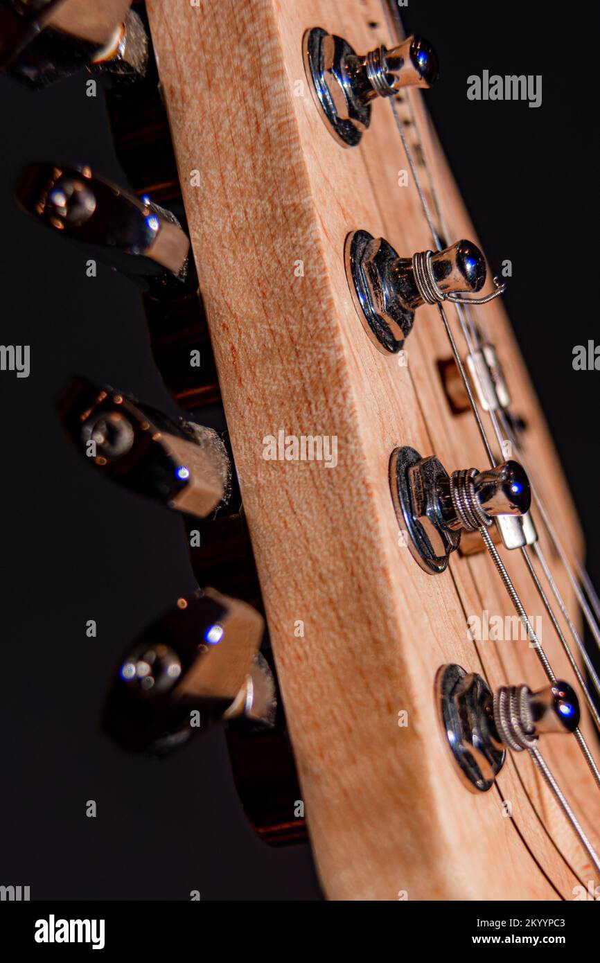Macro detailed shot of an electric guitar on a black background. Stock Photo