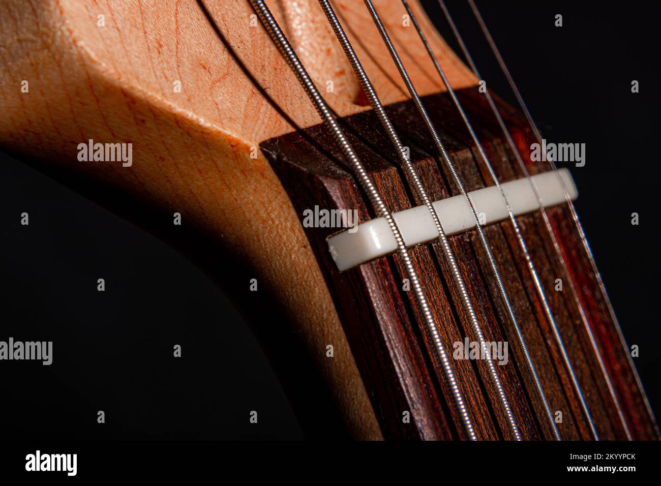 Macro detailed shot of an electric guitar on a black background. Stock Photo