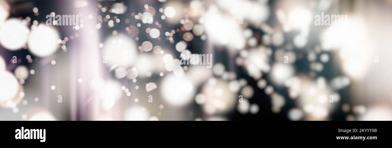 Abstract light celebration background with defocused golden lights for ...