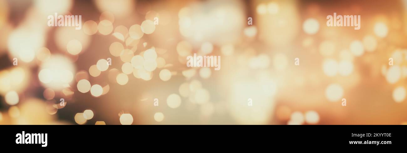 Abstract light celebration background with defocused golden lights for ...