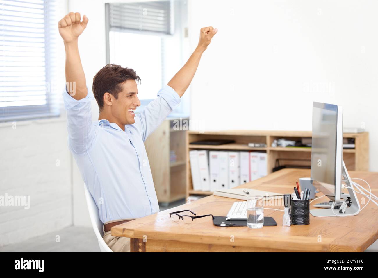 What a great year weve had. a young businessman raising his arms in ...