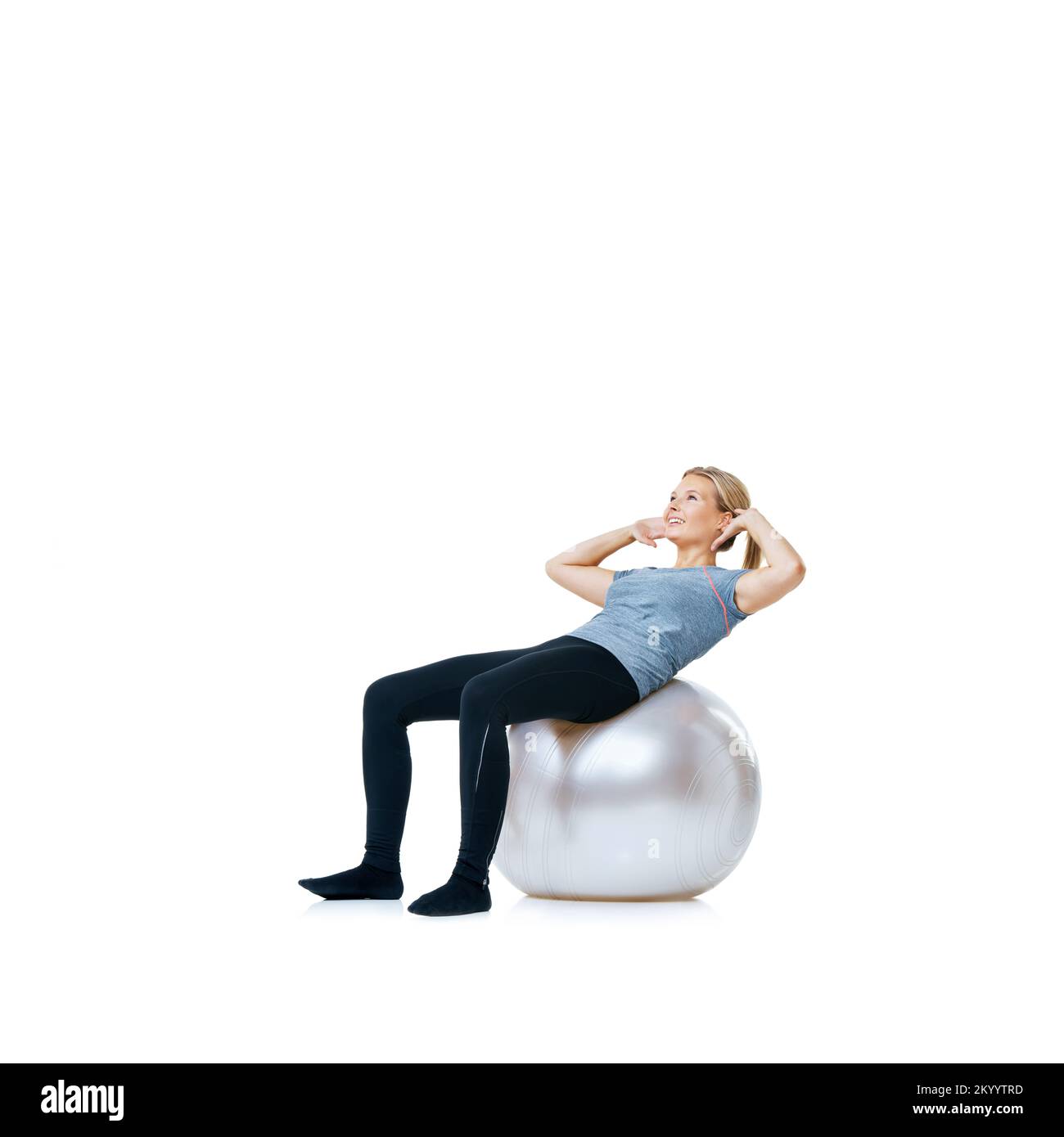 Work that core. A young woman doing stomach crunches on an exercise ball Stock Photo Alamy