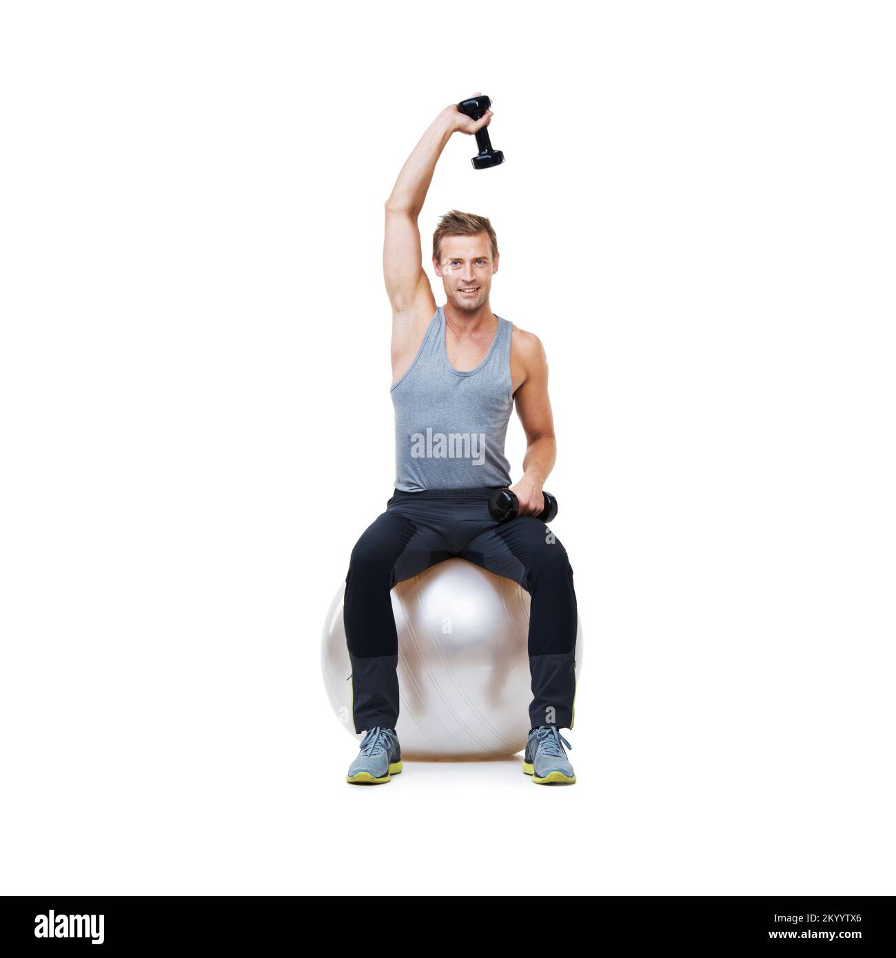 Daily gym routine. Portrait of a man sitting on an exercise ball