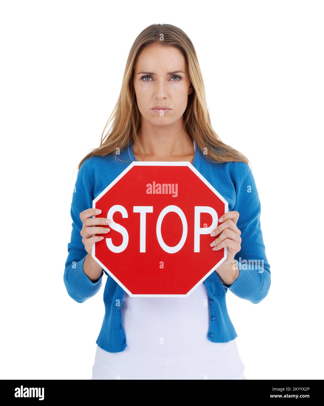 Know what this means. Studio portrait of a stern-looking woman holding a stop sign. Stock Photo