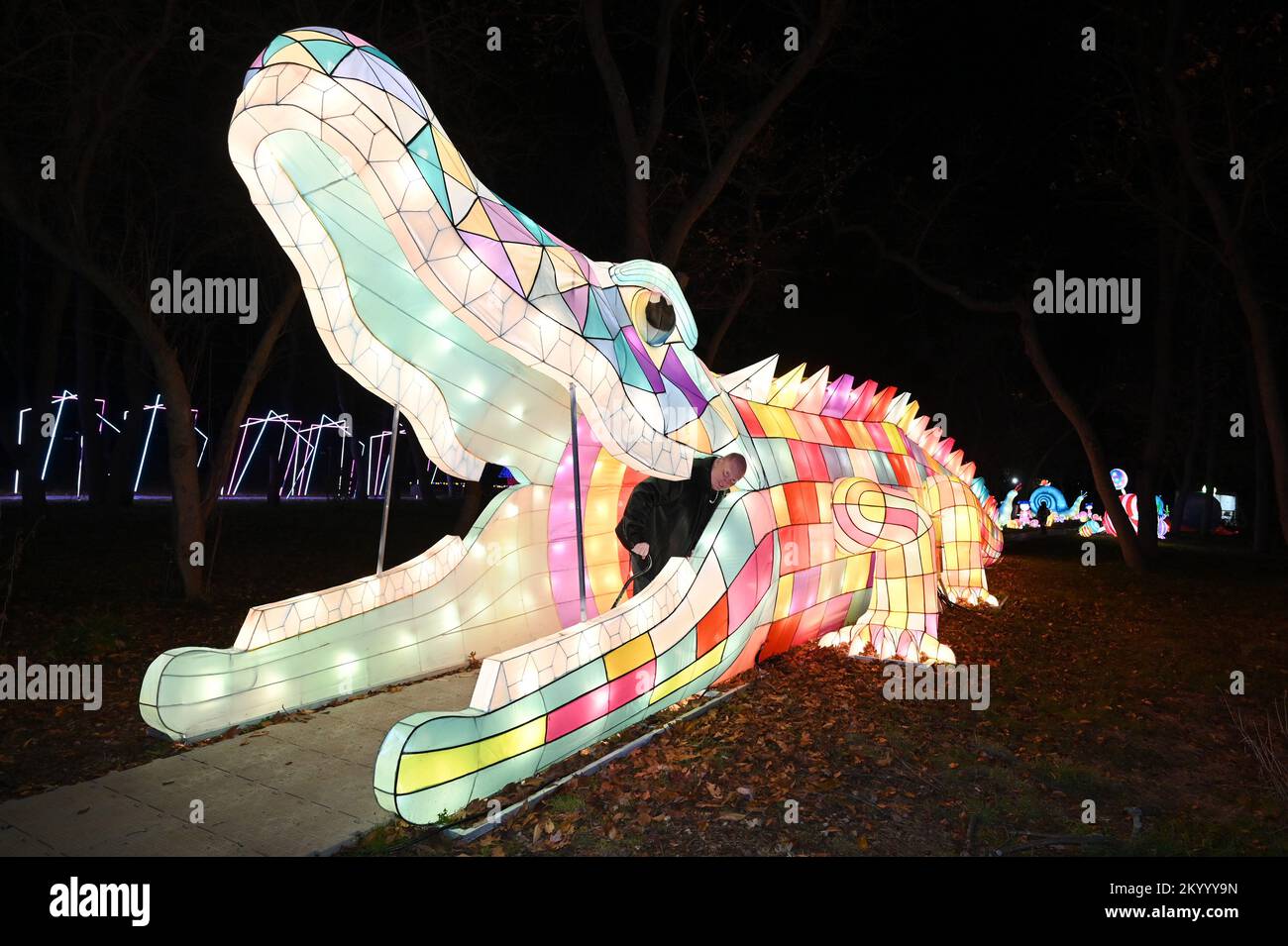 New York, USA. 02nd Dec, 2022. People look at illuminated lantern sculptures as they attend the