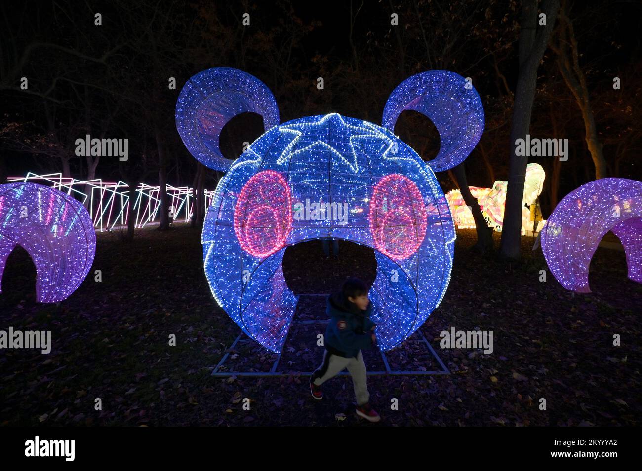 New York, USA. 02nd Dec, 2022. People look at illuminated lantern sculptures as they attend the