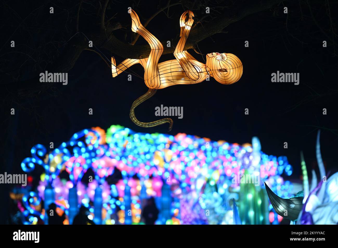 New York, USA. 02nd Dec, 2022. People look at illuminated lantern sculptures as they attend the