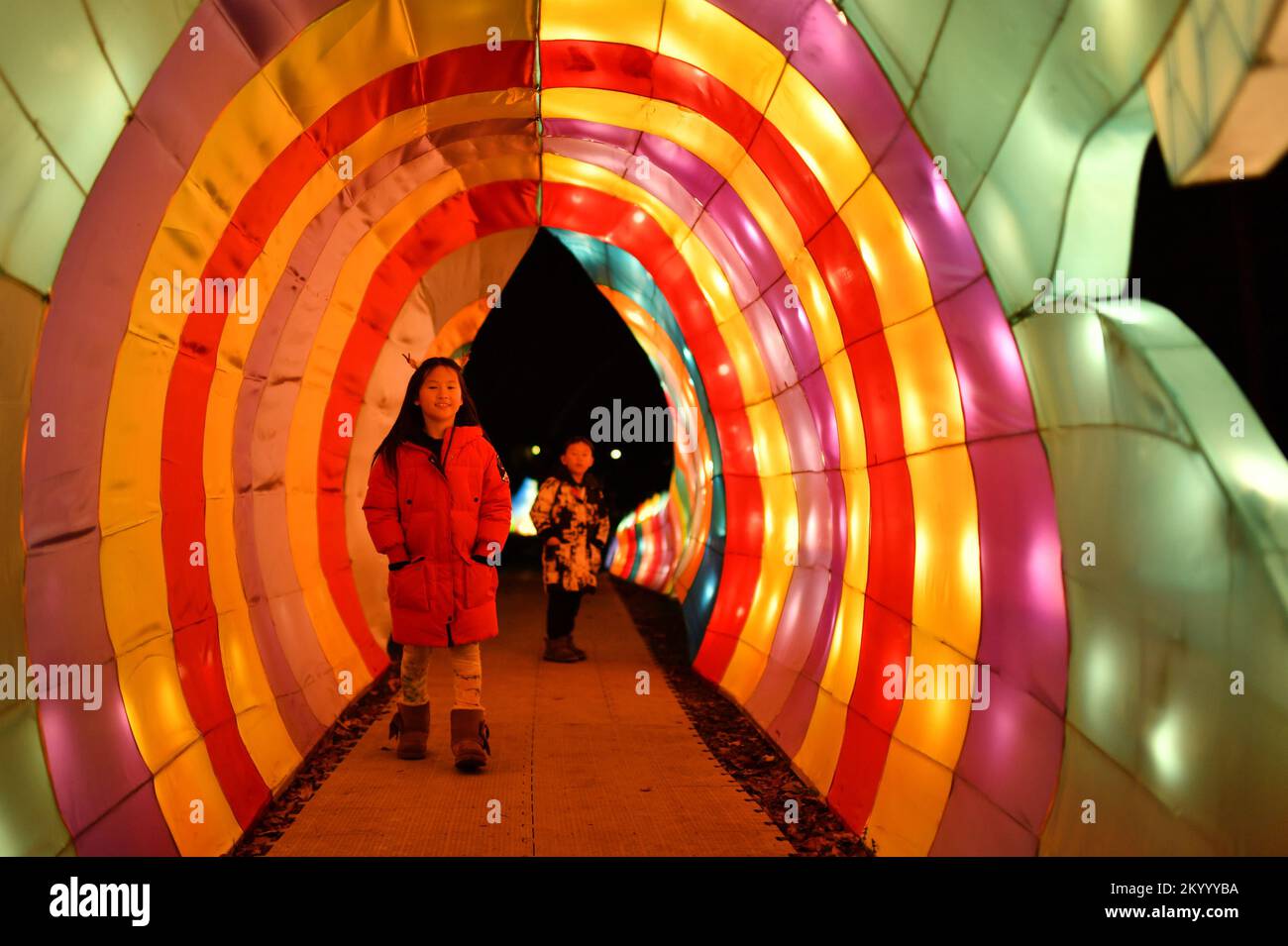 New York, USA . 02nd Dec, 2022. People look at illuminated lantern sculptures as they attend the