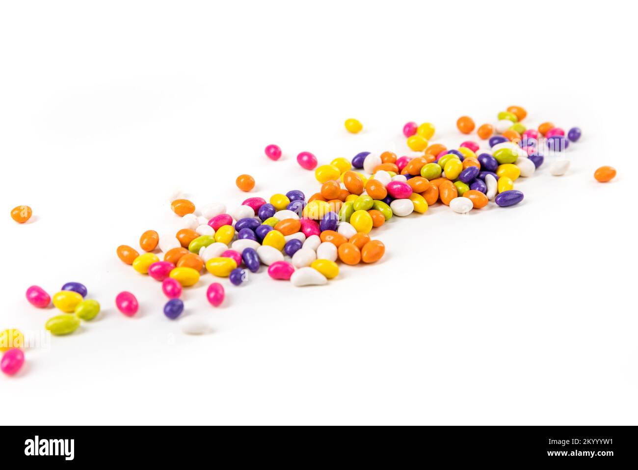 Fennel seed candy narrow strip over white top down view Stock Photo Alamy