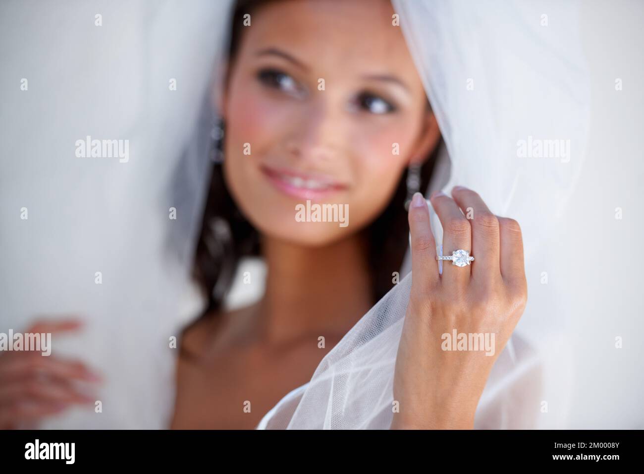 Wedded bliss. A gorgeous young bride showing off her wedding ring. Stock Photo