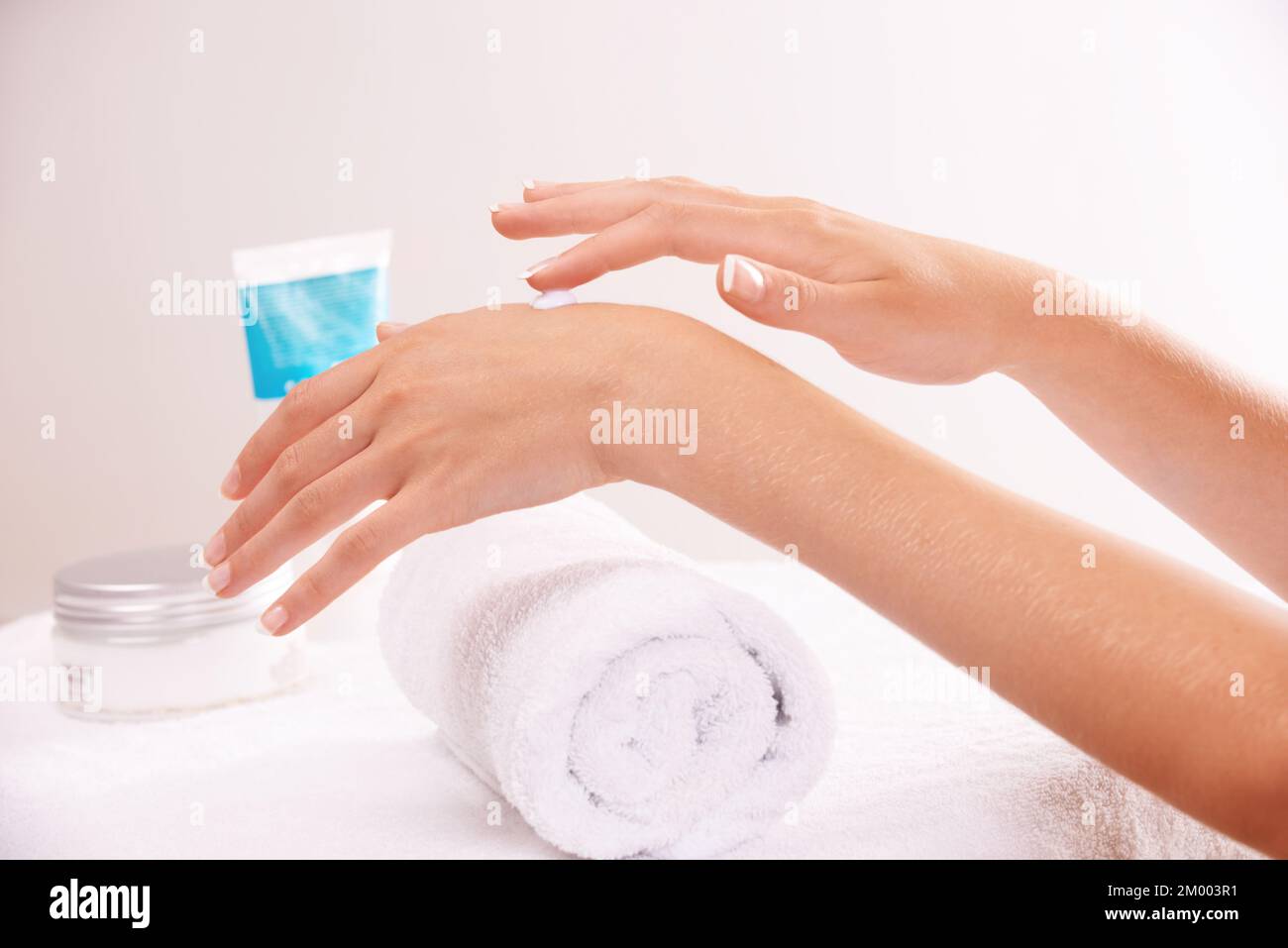 My hands are the main attraction. a woman applying lotion to her hands. Stock Photo