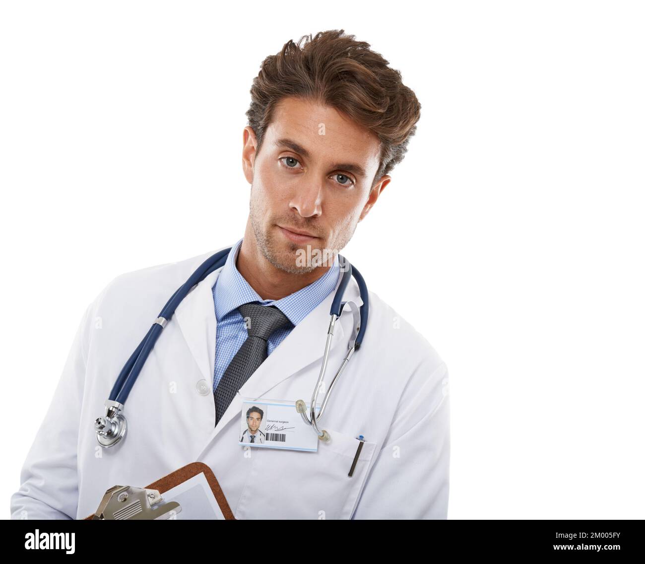 Hes serious about your wellbeing. Studio shot of a serious-looking young medical professional holding a clipboard. Stock Photo