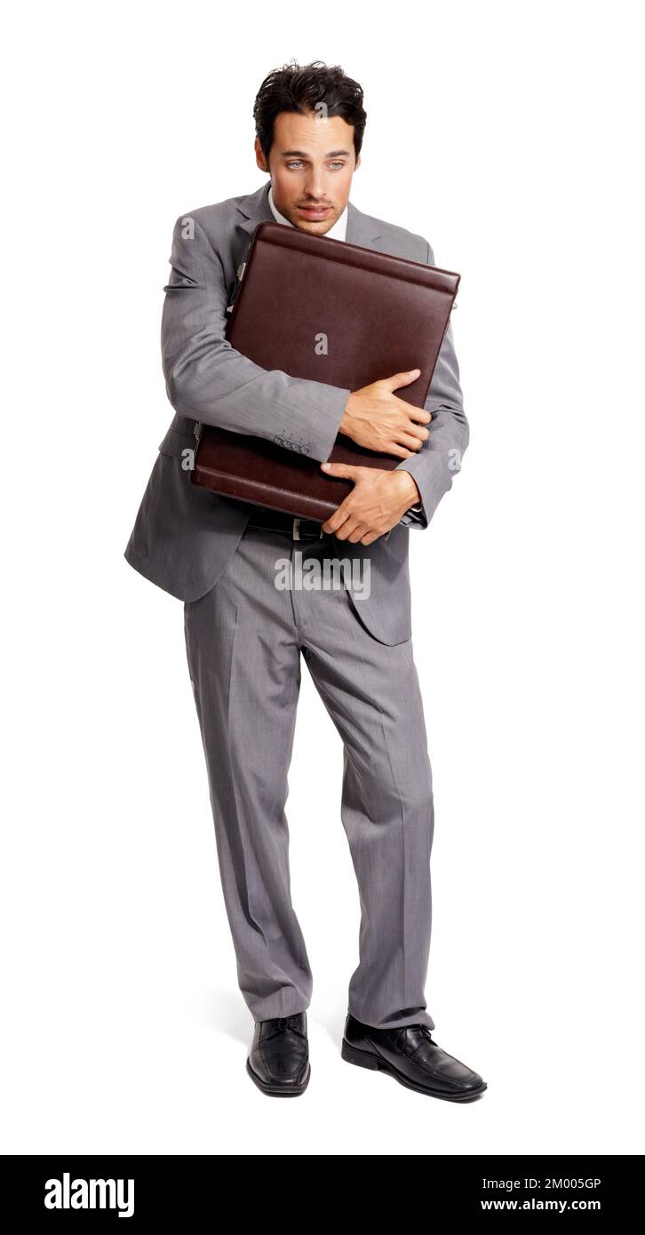 I cannot lose these documents. Full-length shot of a young executive clutching his briefcase to his chest. Stock Photo