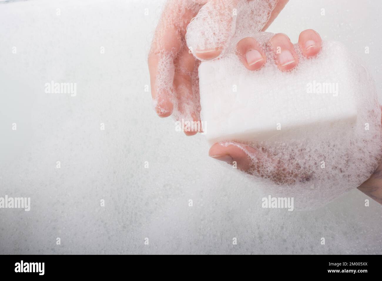 Hand washing and soap foam on a foamy background Stock Photo