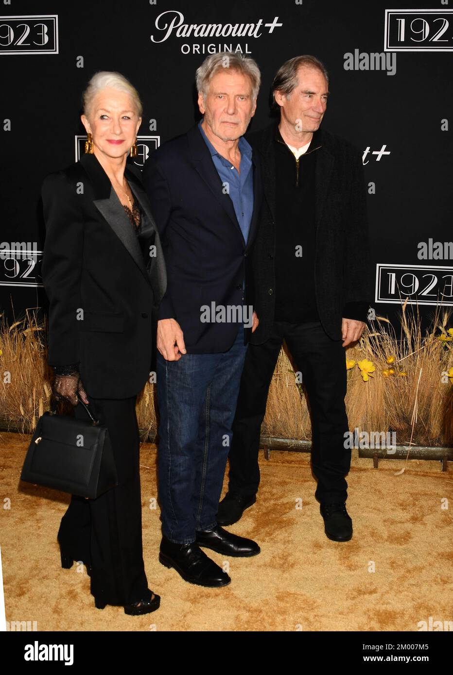 LOS ANGELES, CALIFORNIA - DECEMBER 02: (L-R) Helen Mirren, Harrison Ford and Timothy Dalton attend the Los Angeles Premiere Of Paramount+'s '1923' at Stock Photo
