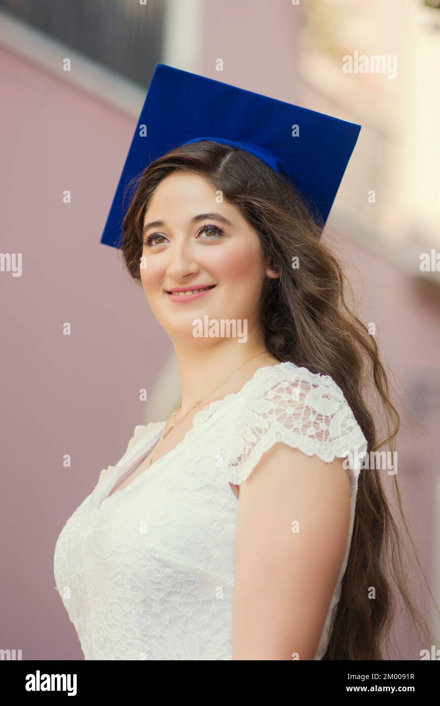 Beautiful female university graduate outdoors Stock Photo - Alamy